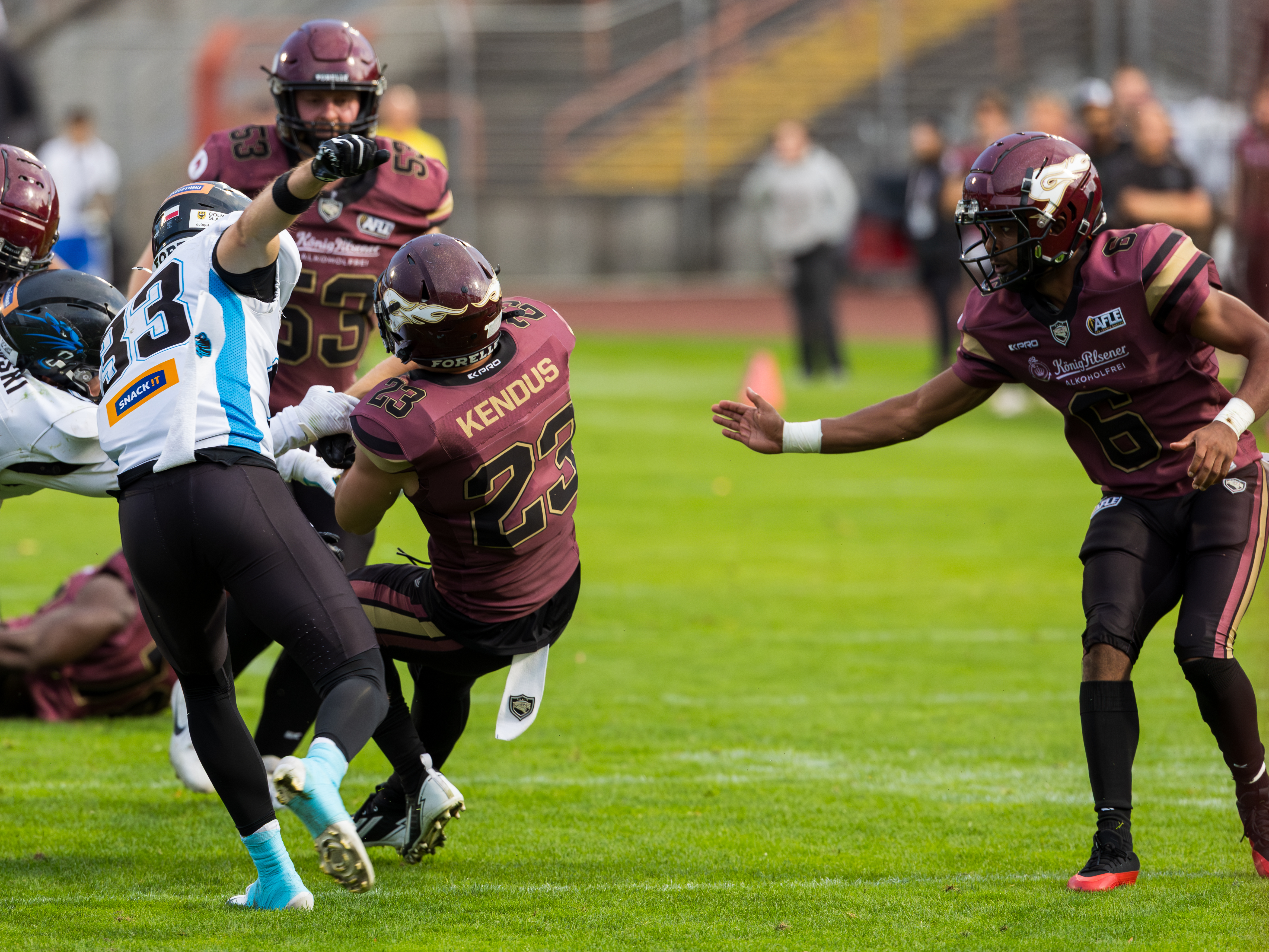 #33 Ben Wenzler (Cornerback) – Panthers Wroclaw tackle #23 Sergej Kendus (Running Back) – Rhein Fire