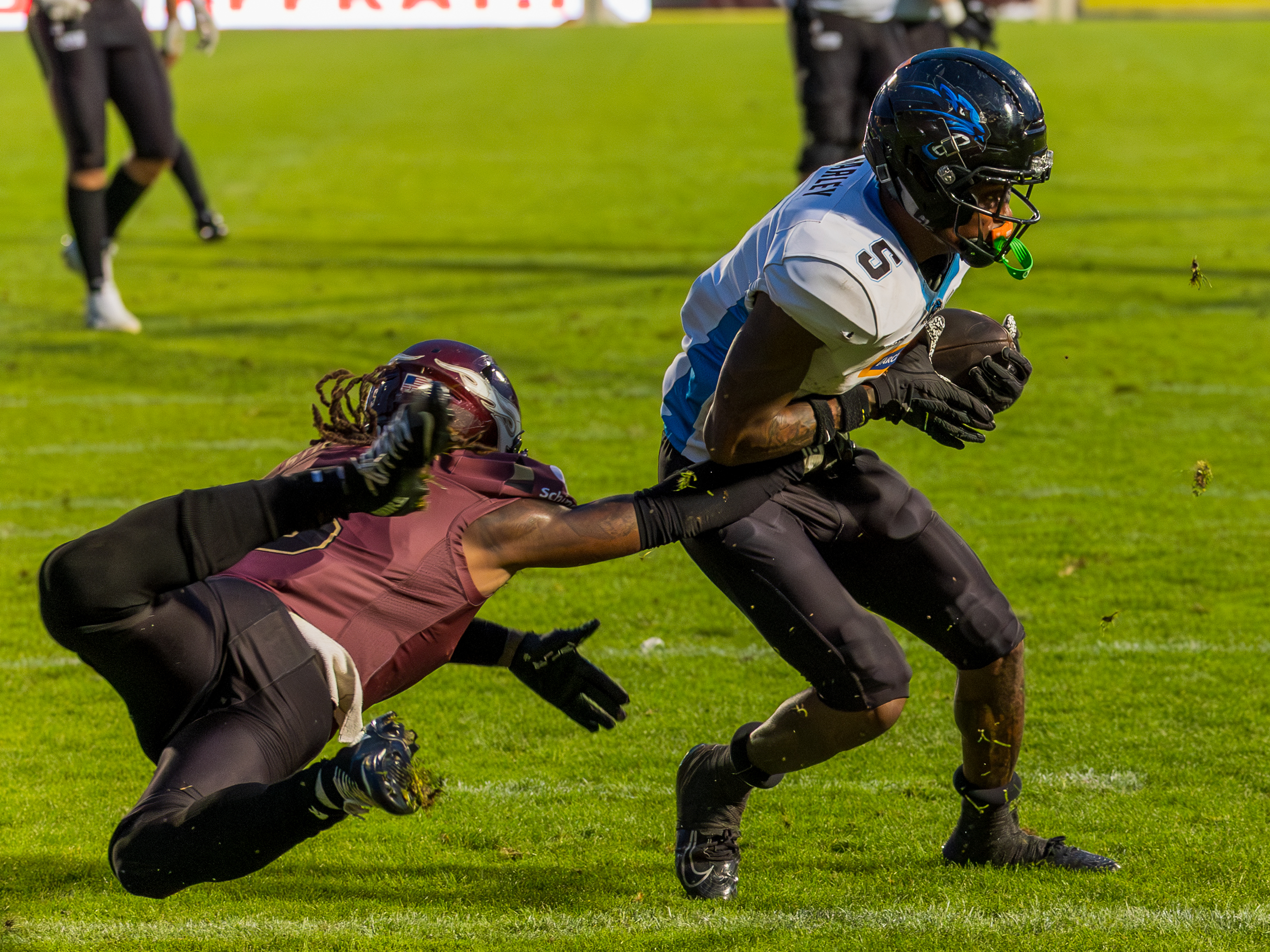 #5 Nazir Streater (Strong Saftey) – Rhein Fire jump to tackle. #5 Michael Harley Jr (Wide Receiver) – Panthers Wroclaw run with the ball.