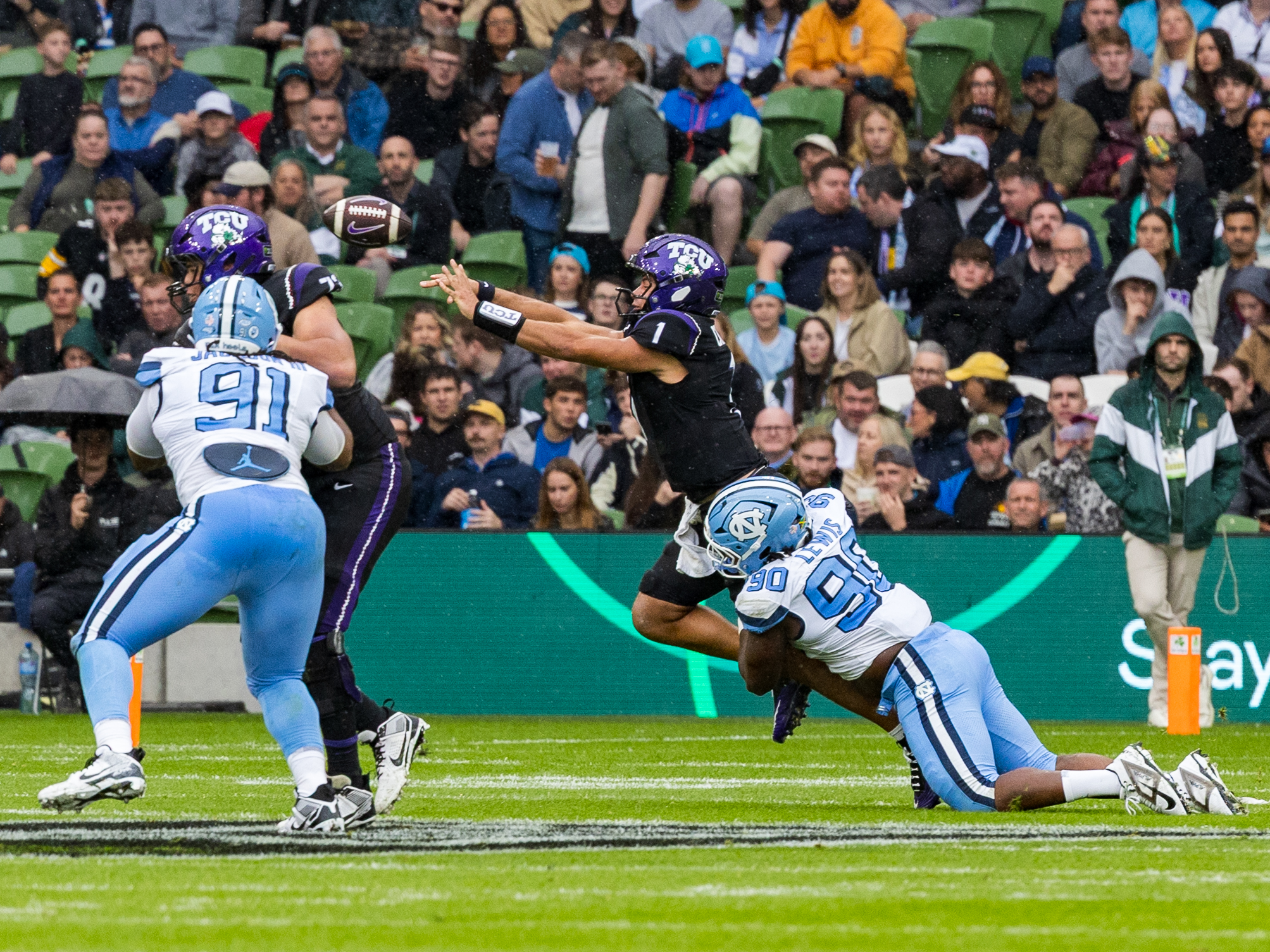 #90 Xavier Lewis (DL) University of North Carolina Tar Heels tackle for a sack at #1 Jaden Craig (QB) TCU Horned Frogs