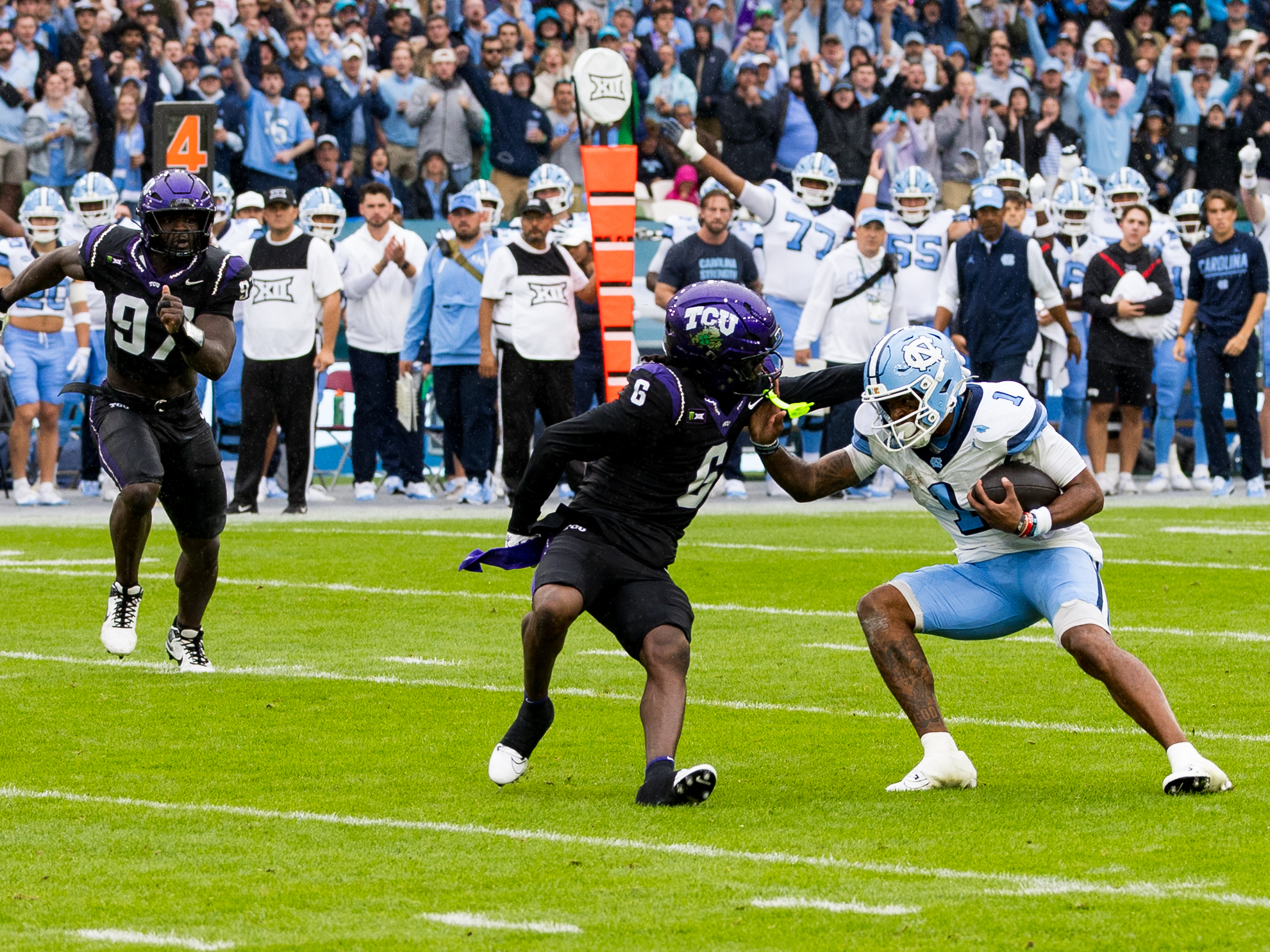#1 Jordan Shipp (WR) University of North Carolina Tar Heels stiff arm to #6 Kylin Jackson (S) TCU Horned Frogs