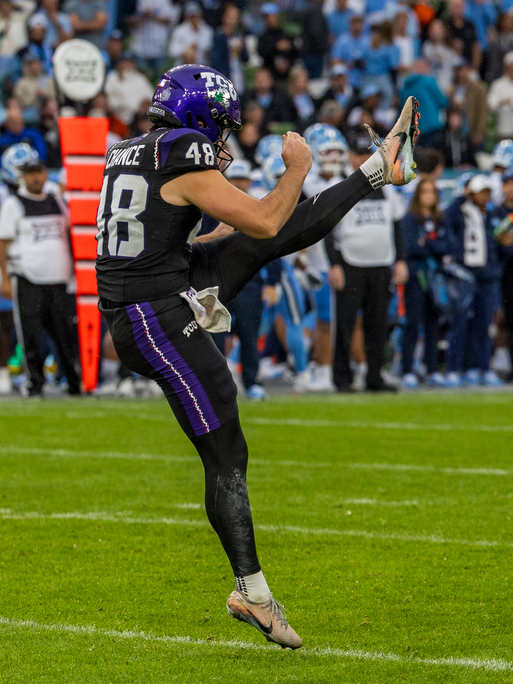 #48 John Hoyet Chance (P) TCU Horned Frogs punt the ball.