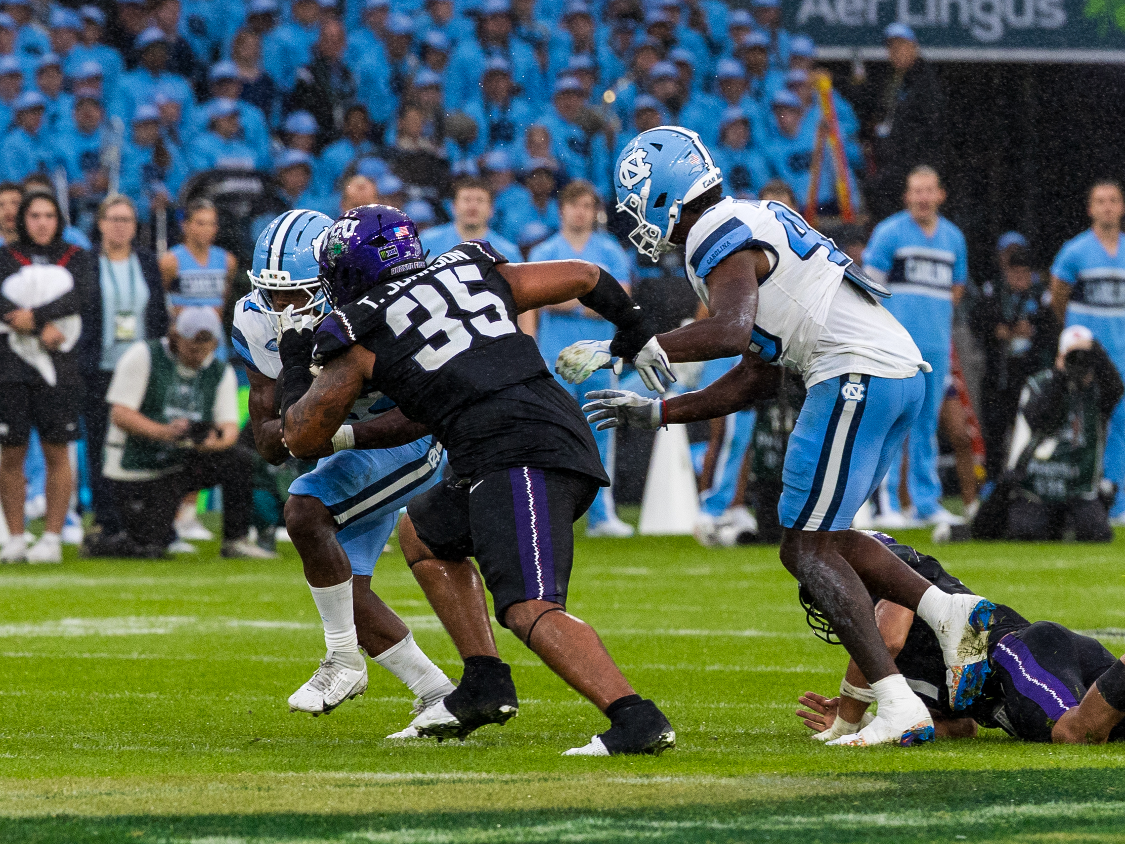 #35 Tristan Johnson (DT) TCU Horned Frogs on the way to tackle from #7 Benjamin Hall (RB) University of North Carolina Tar Heels