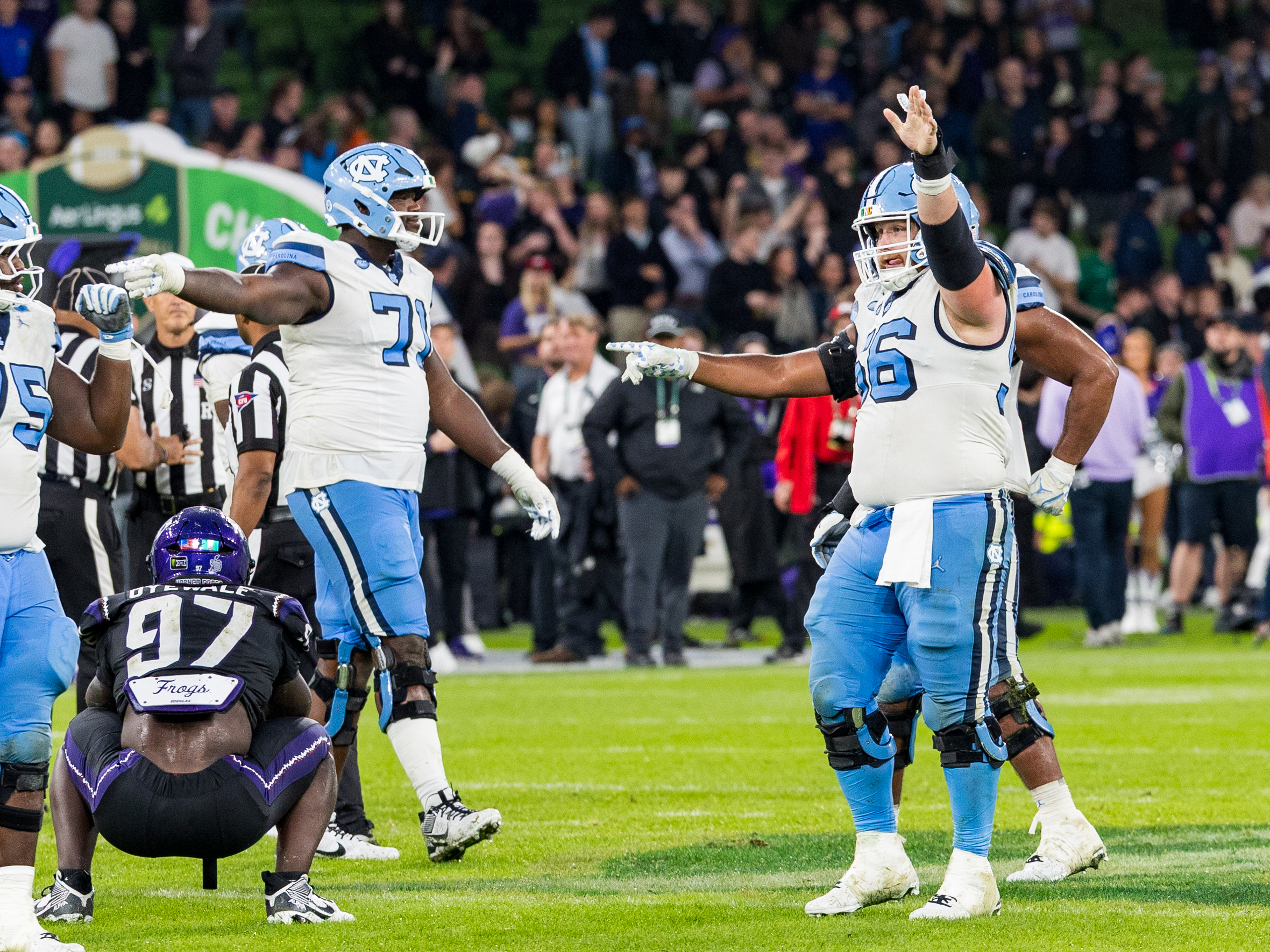 #56 Christo Kelly (OL) University of North Carolina Tar Heels points to the defense.