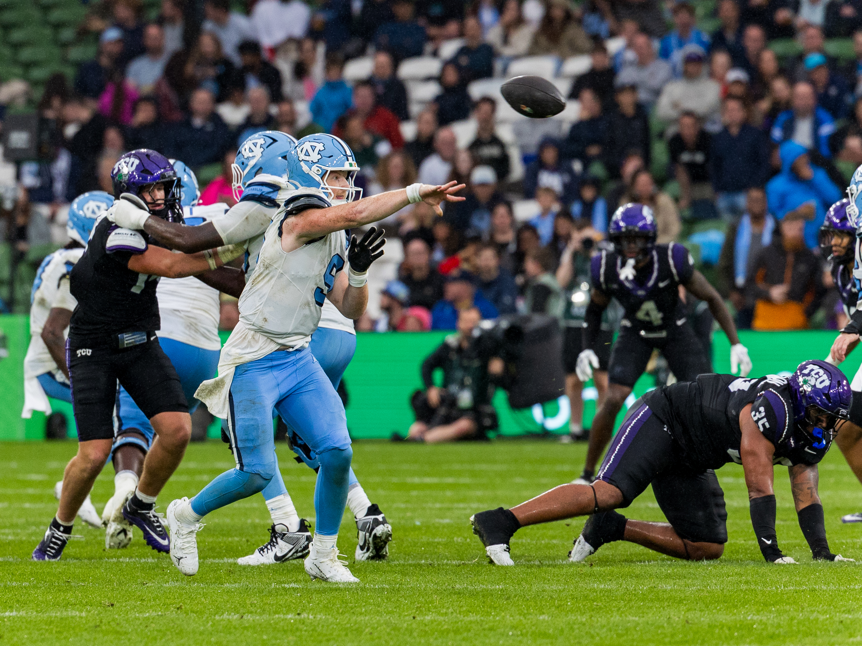 #9 Billy Edwards Jr. (QB) University of North Carolina Tar Heels pass the ball to a target.