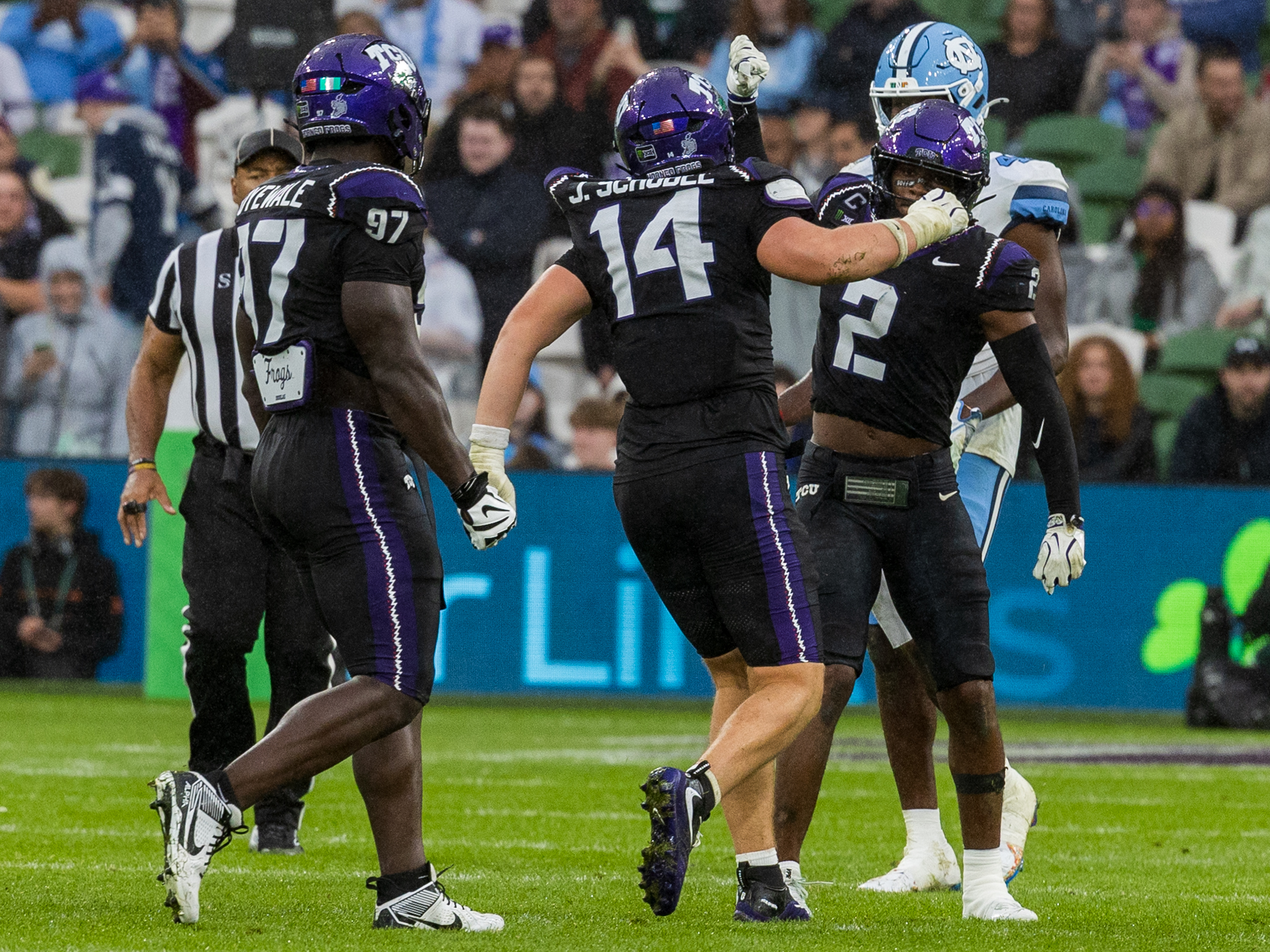 Tackle celebration from #14 John Schobel (EDGE) TCU Horned Frogs and #2 Jamel Johnson (S) TCU Horned Frogs