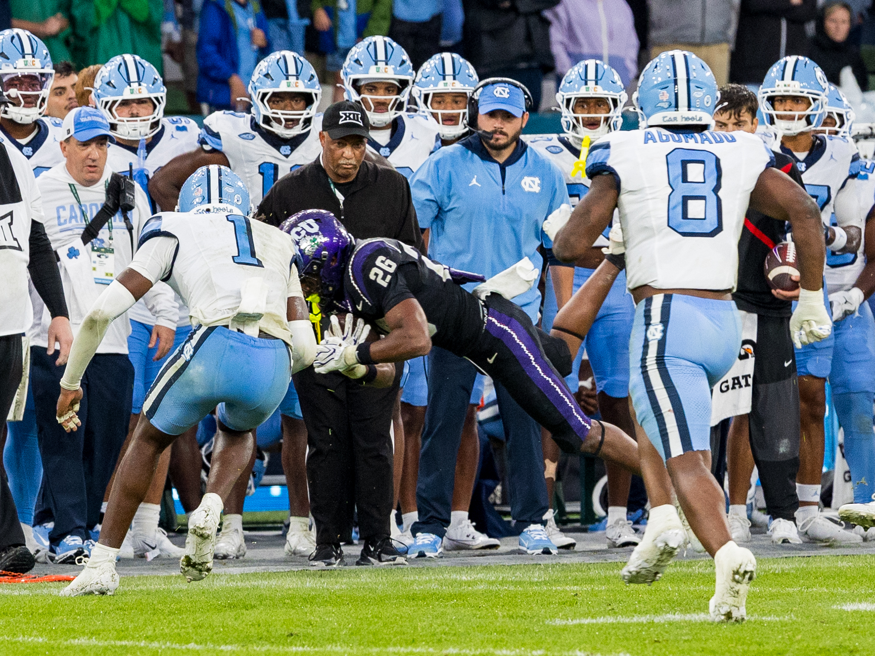 #26 Jeremy Payne (RB) TCU Horned Frogs jump the the first down marker outside.