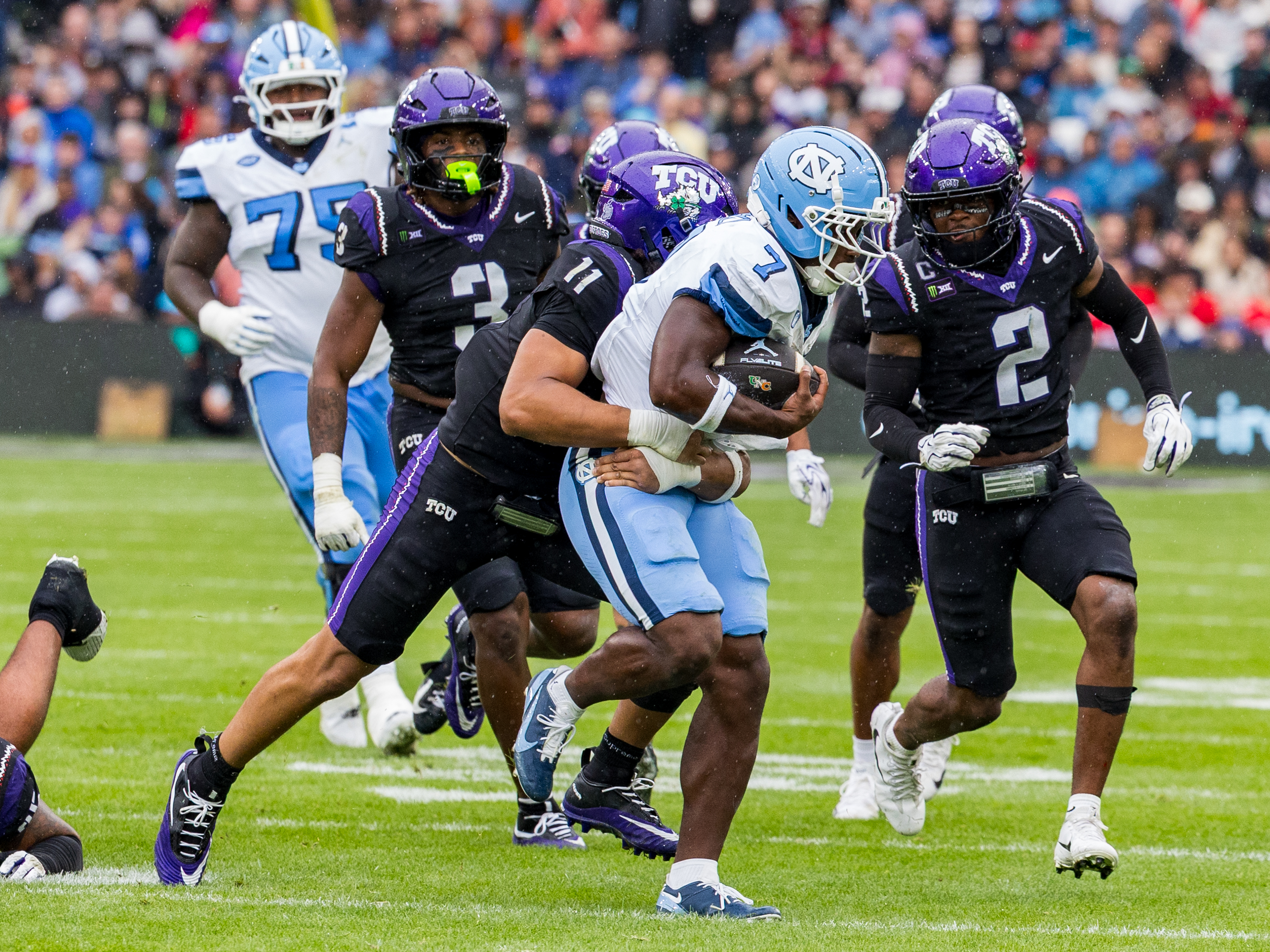 #11 Michael Short (LB) TCU Horned Frogs tackle #7 Benjamin Hall (RB) University of North Carolina Tar Heels