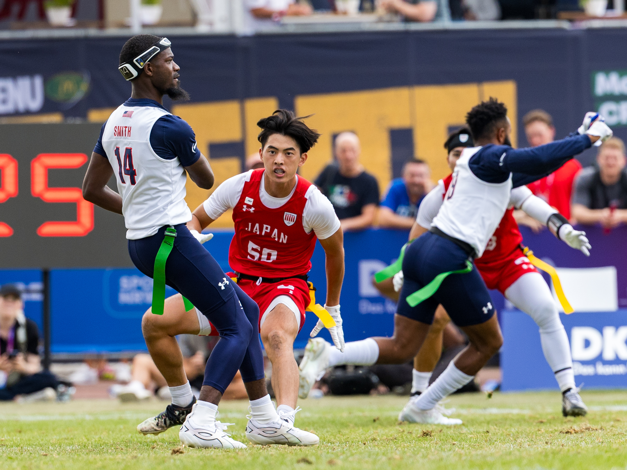 #14 Laderrick "Pablo" Smith (ATH) Team USA Men pass the ball. #50 KO KAWASAKI ( DB/WR ) Team Japan Men to late for a tackle