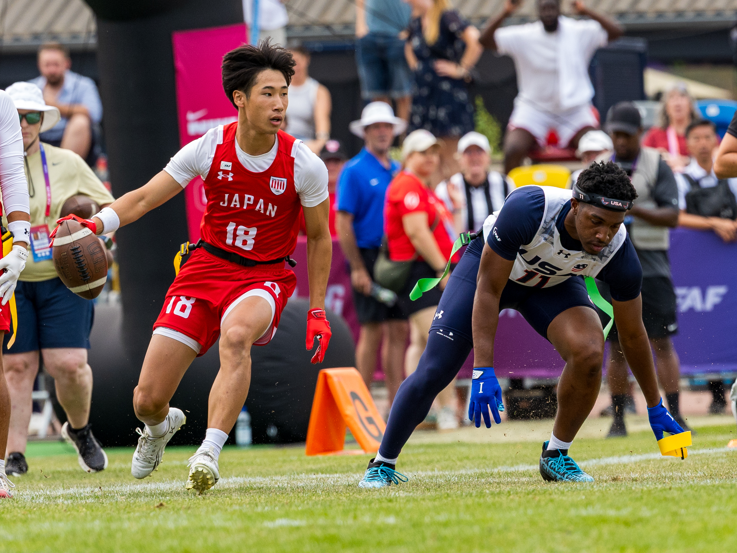 #11 Isaiah CalhounTheard Jr (DB) Team USA Men catch the flag from #18 KODAI OKUMURA ( WR/DB ) Team Japan Men