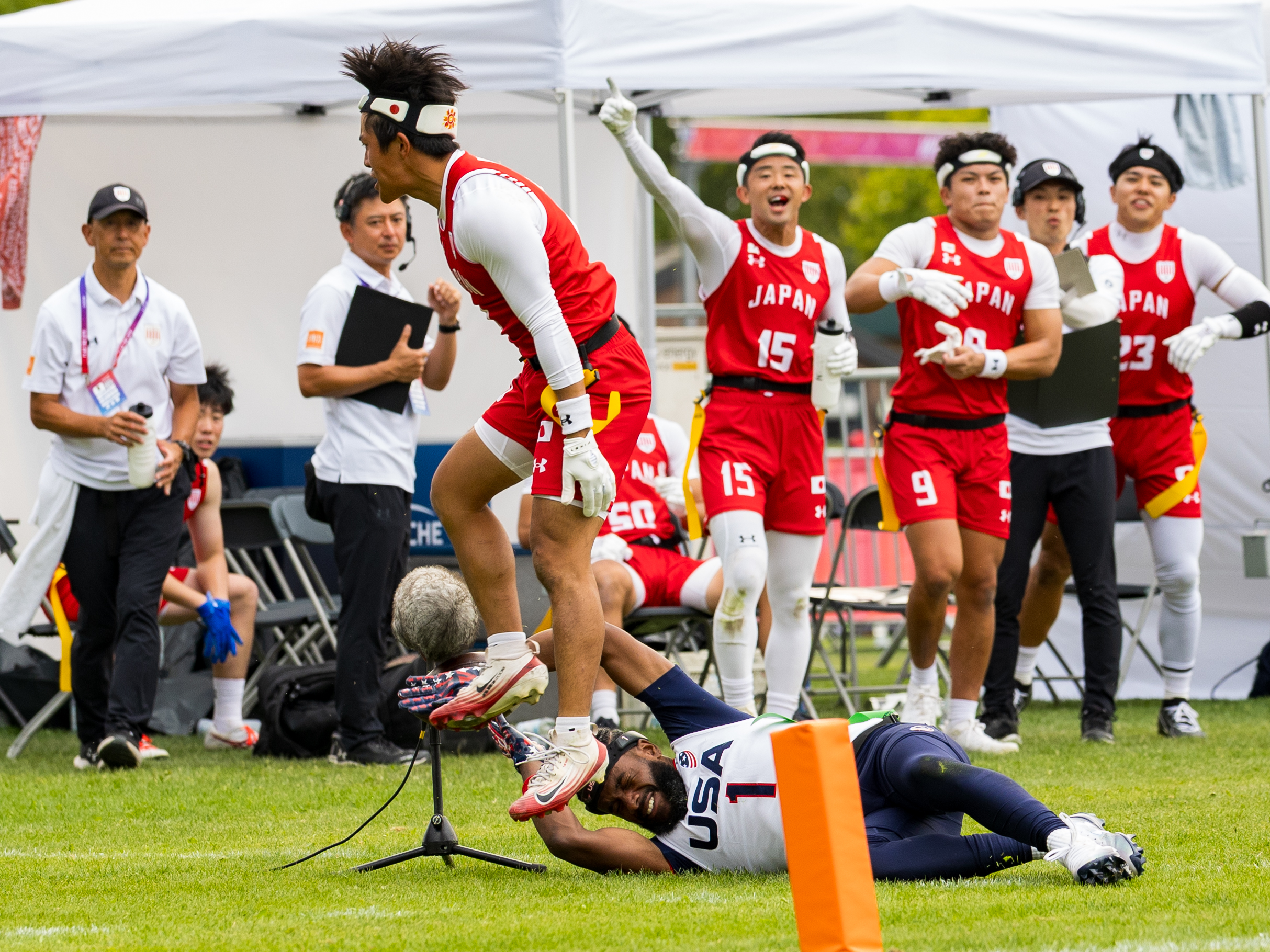 Touchdown from #0 REI IWAI ( WR/DB ) Team Japan Men. #1 Antonio Coleman (QB/ATH) Team USA Men to late for a tackle.