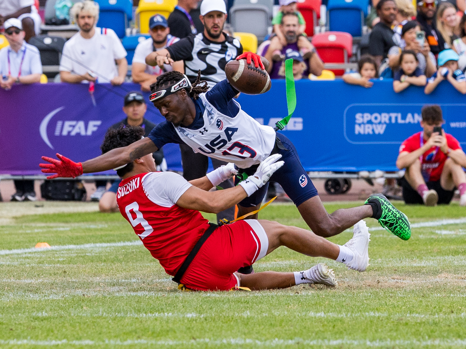 #9 HARUKI SUZUKI ( DB/WR ) Team Japan Men tackle #13 Velton Brown Jr (WR/DB) Team USA Men after first down