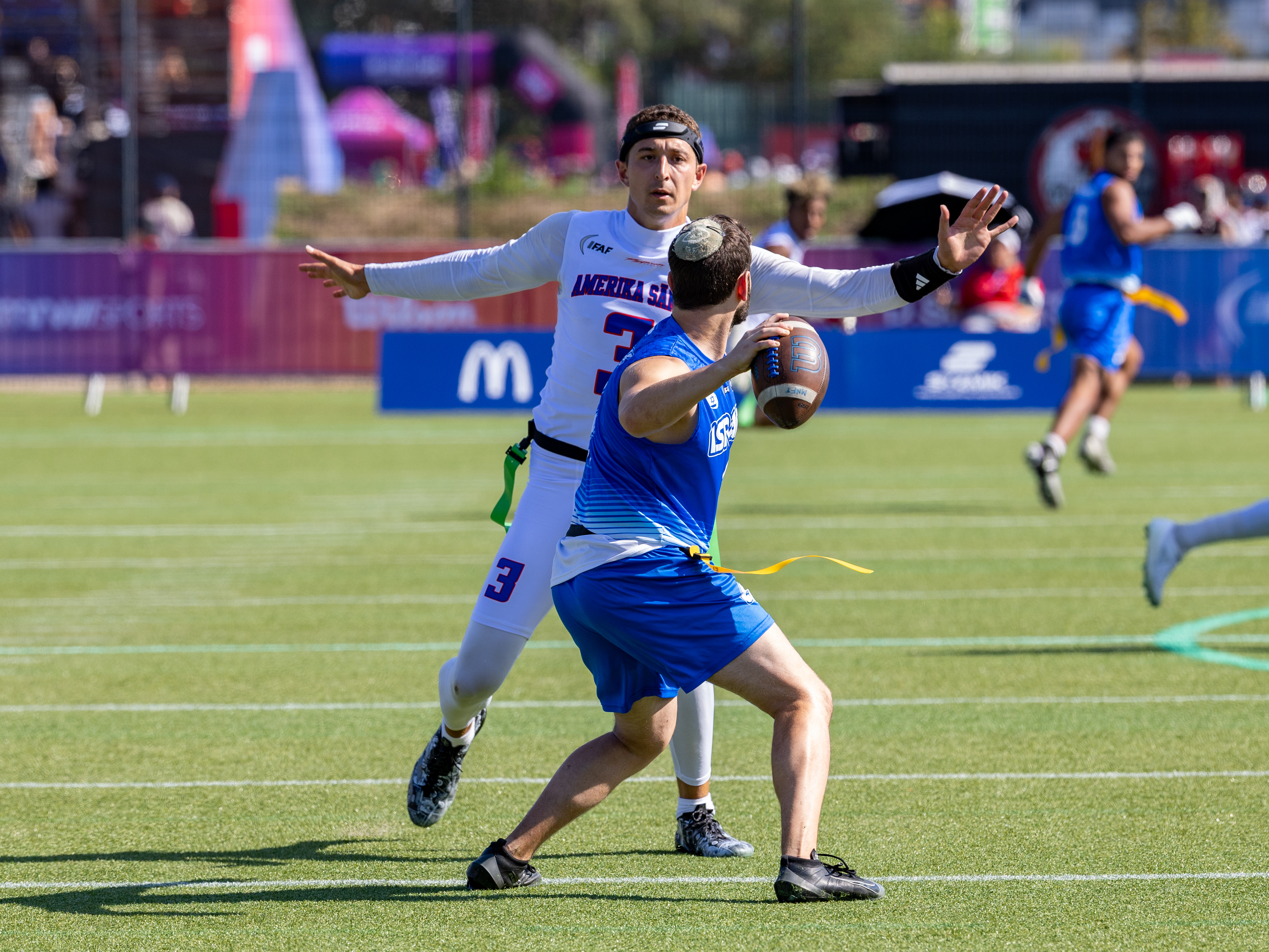 #3 Tai Natani-Othoniel Tiedemann (QB) Team American Samoa Men block the pass from #4 AVRAHAM FARKAS (QB) Team Israel Men