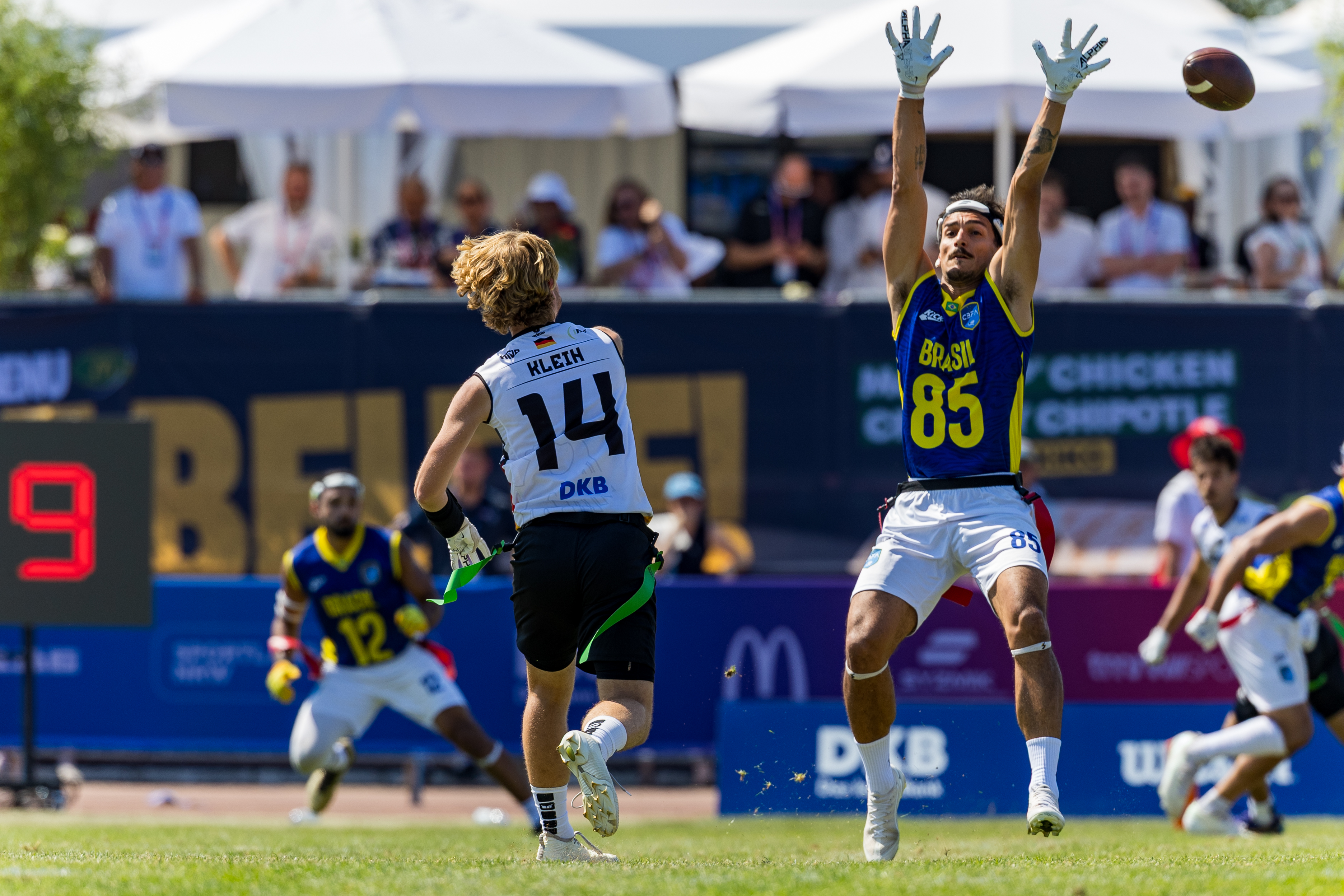 #14 Philipp Marco Klein (QB) Team Germany Men pass the ball. #85 Bernardo Horevitch Kusdra (DB) Team Brazil Me to late for a block.