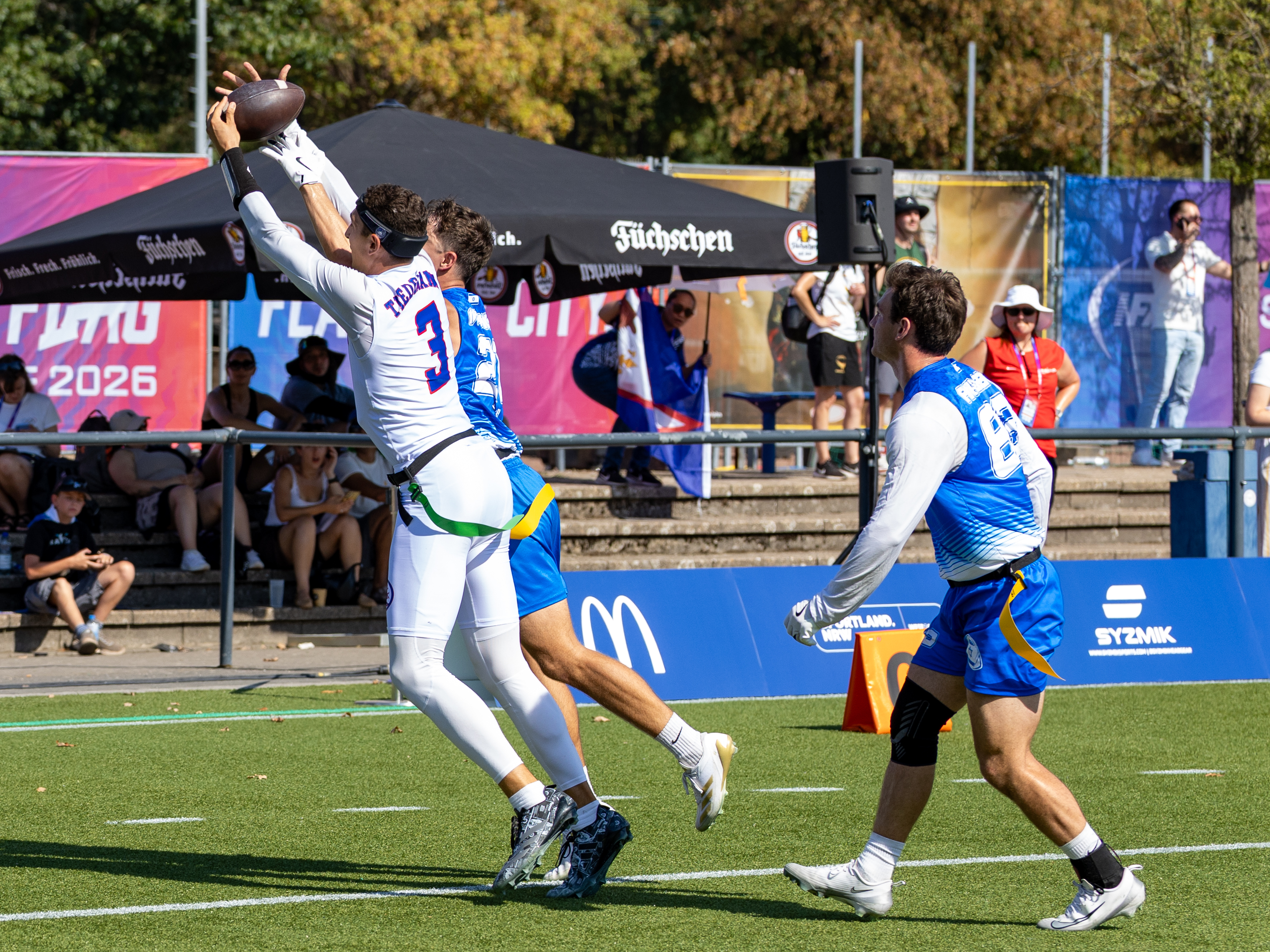#21 DAVID IVASHUK (DB) Team Israel Men and #3 Tai Natani-Othoniel Tiedemann (QB) Team American Samoa Men fight for the ball.