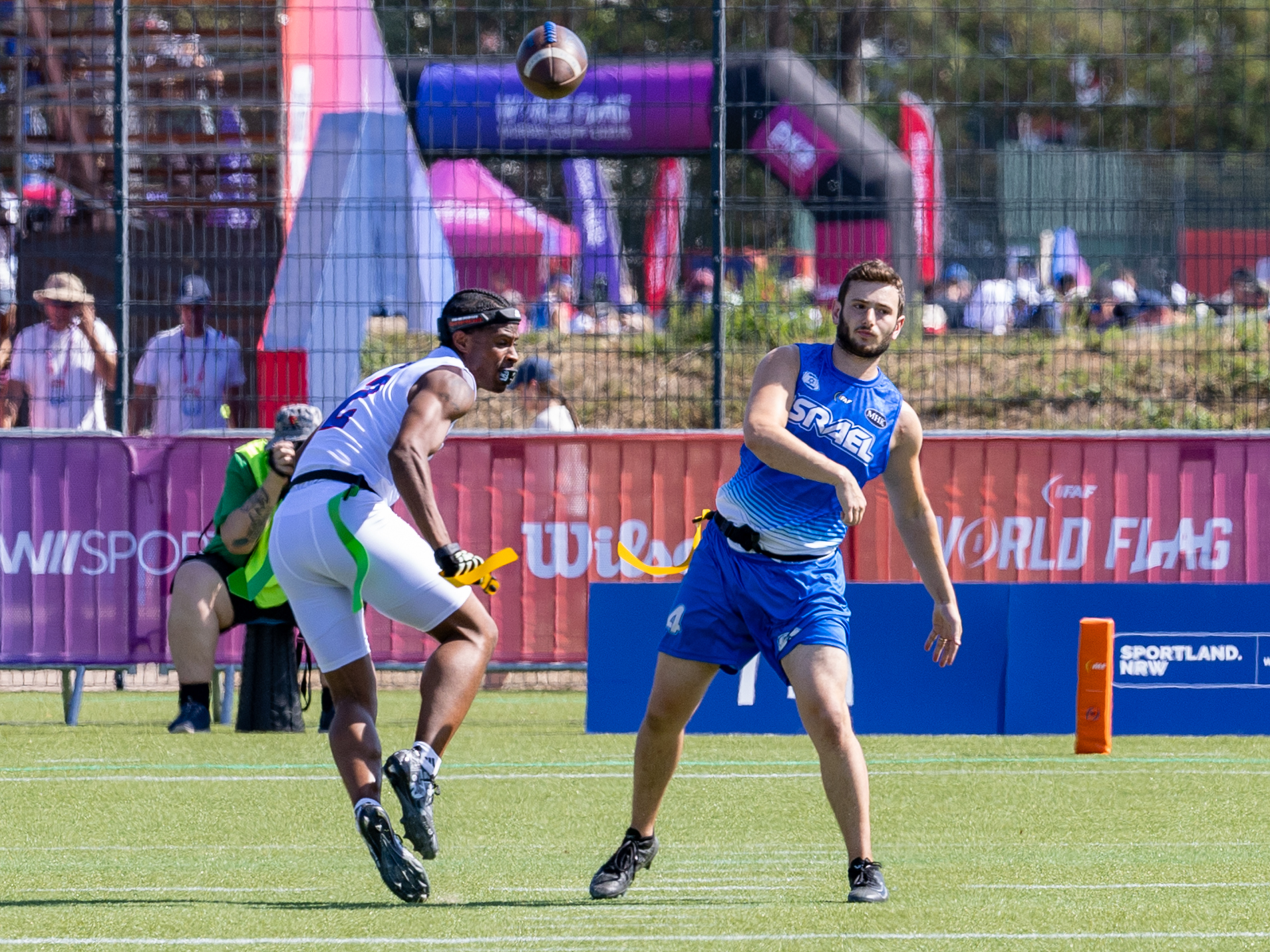 #2 Antonio Hill (WR/DB) Team American Samoa Men to late for block the ball. #10 MATAN BAUMAN (WR) Team Israel Men pass the ball.