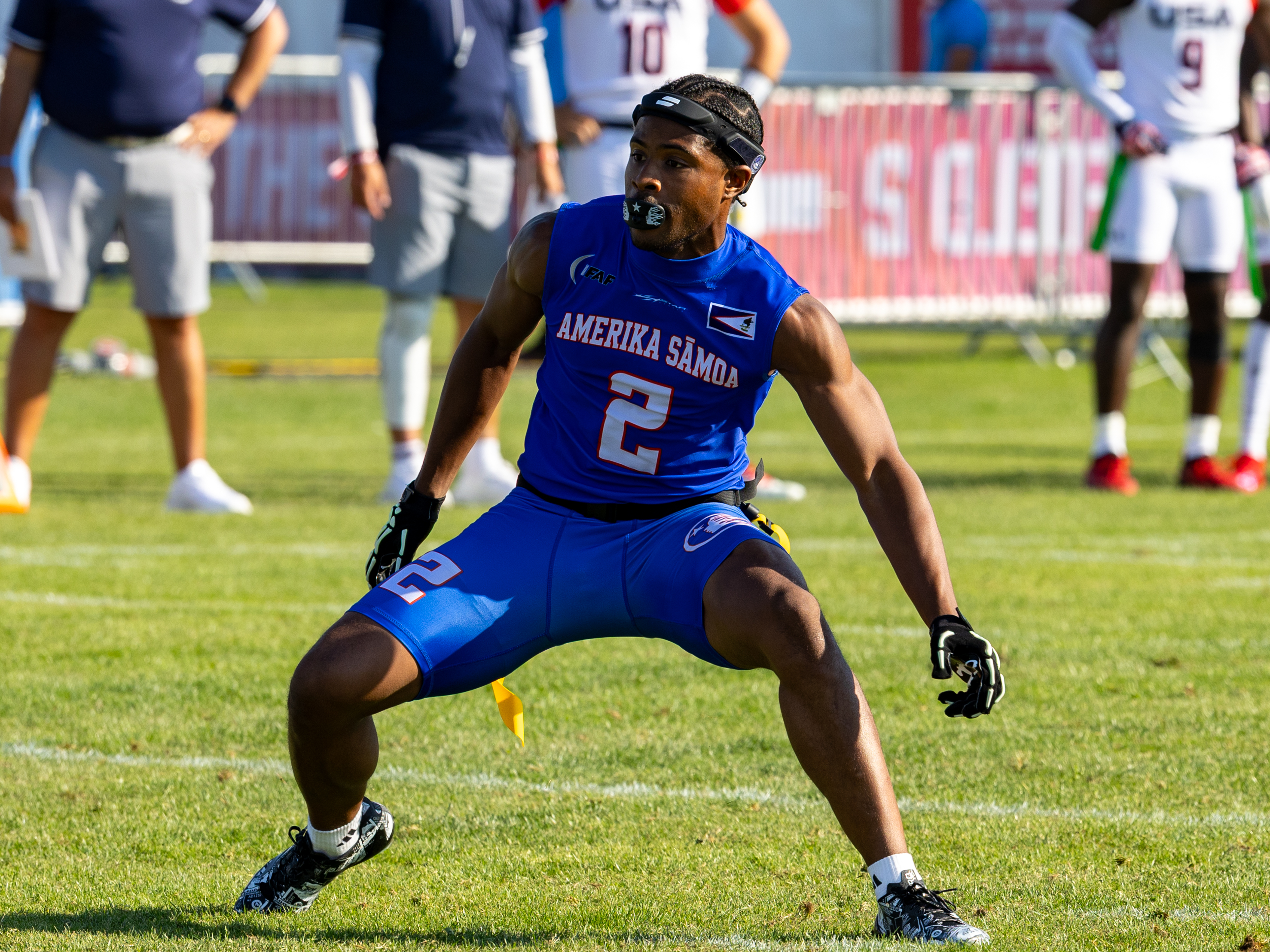 #2 Antonio Hill (WR/DB) Team American Samoa Men look at the US Player.