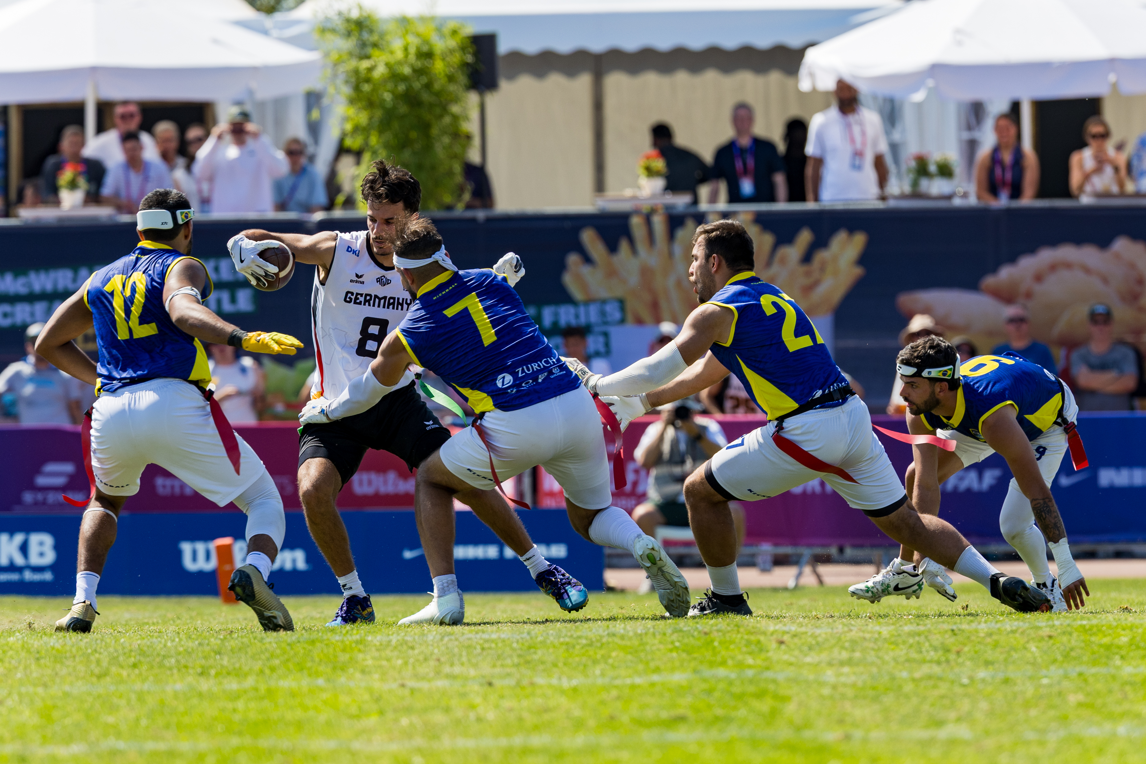 #7 Edmar Dos Santos (DB) Team Brazil Me, #12 Felipe Nunes Almeida dos Santos (DB) Team Brazil Me and #27 Lucas José de Almeida Gonçalves (WR) Team Brazil Me stop #8 Malik Al-Kahlout (WR) Team Germany Men