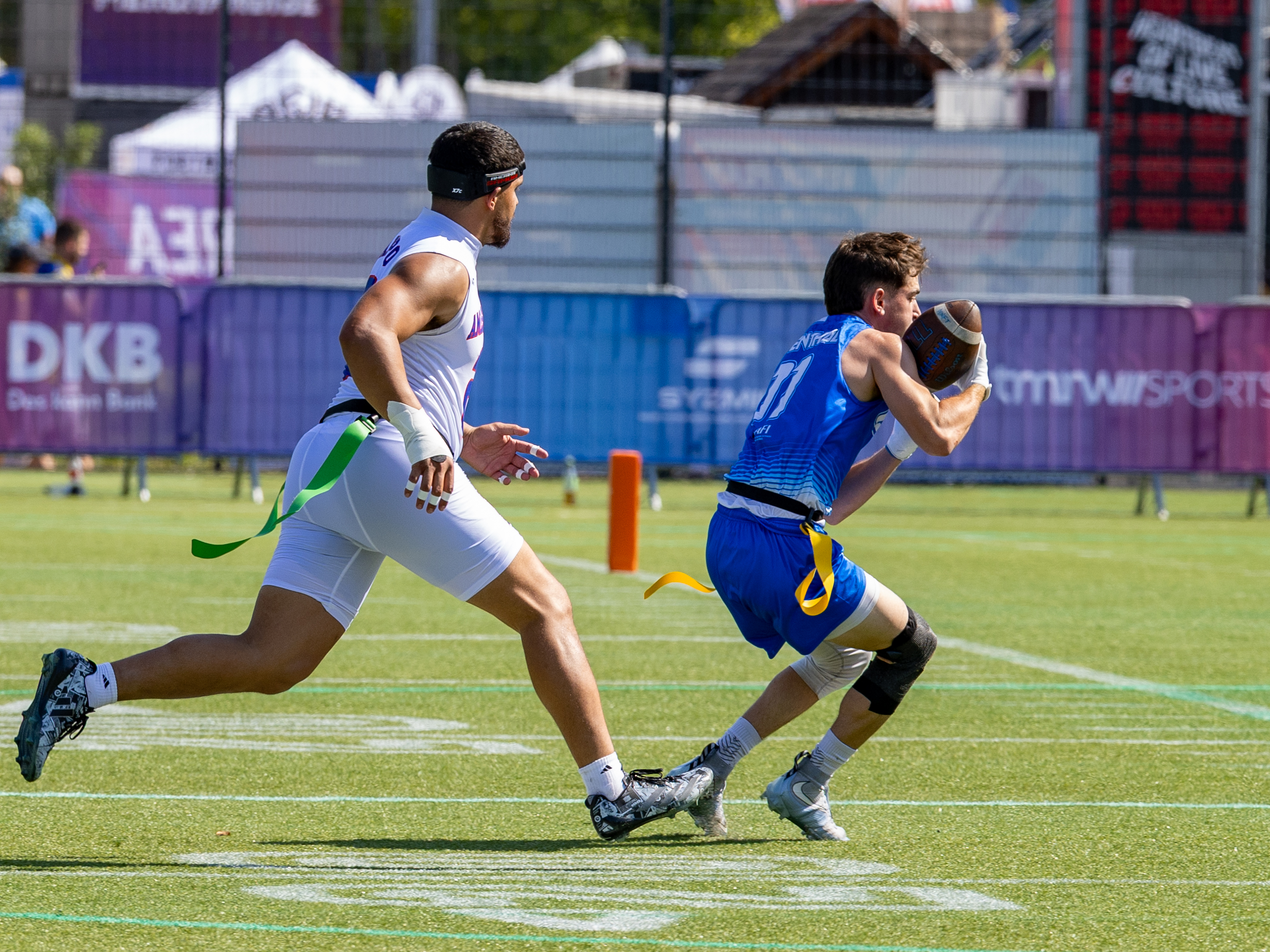 #11 JOSHUA LEVENTHAL (WR) Team Israel Men catch the ball for a first down. #21 London Constantine Teidemann Iakopo (WR/DB) Team American Samoa Men run to the player#