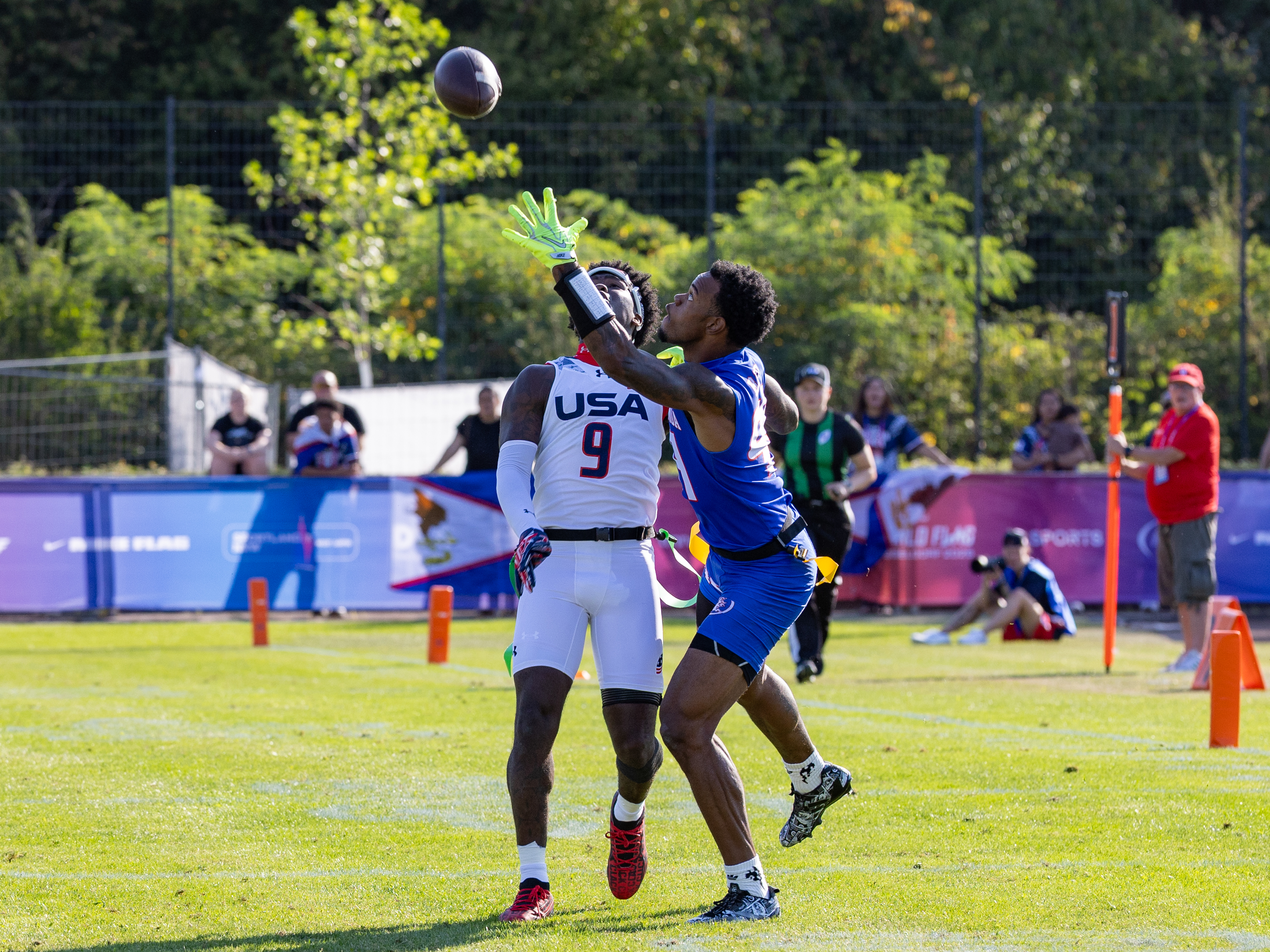 #9 Justin McMullen (DB/C) look at the ball. #99 Bralon Brown (WR/DB) Team American Samoa Men catch the ball.