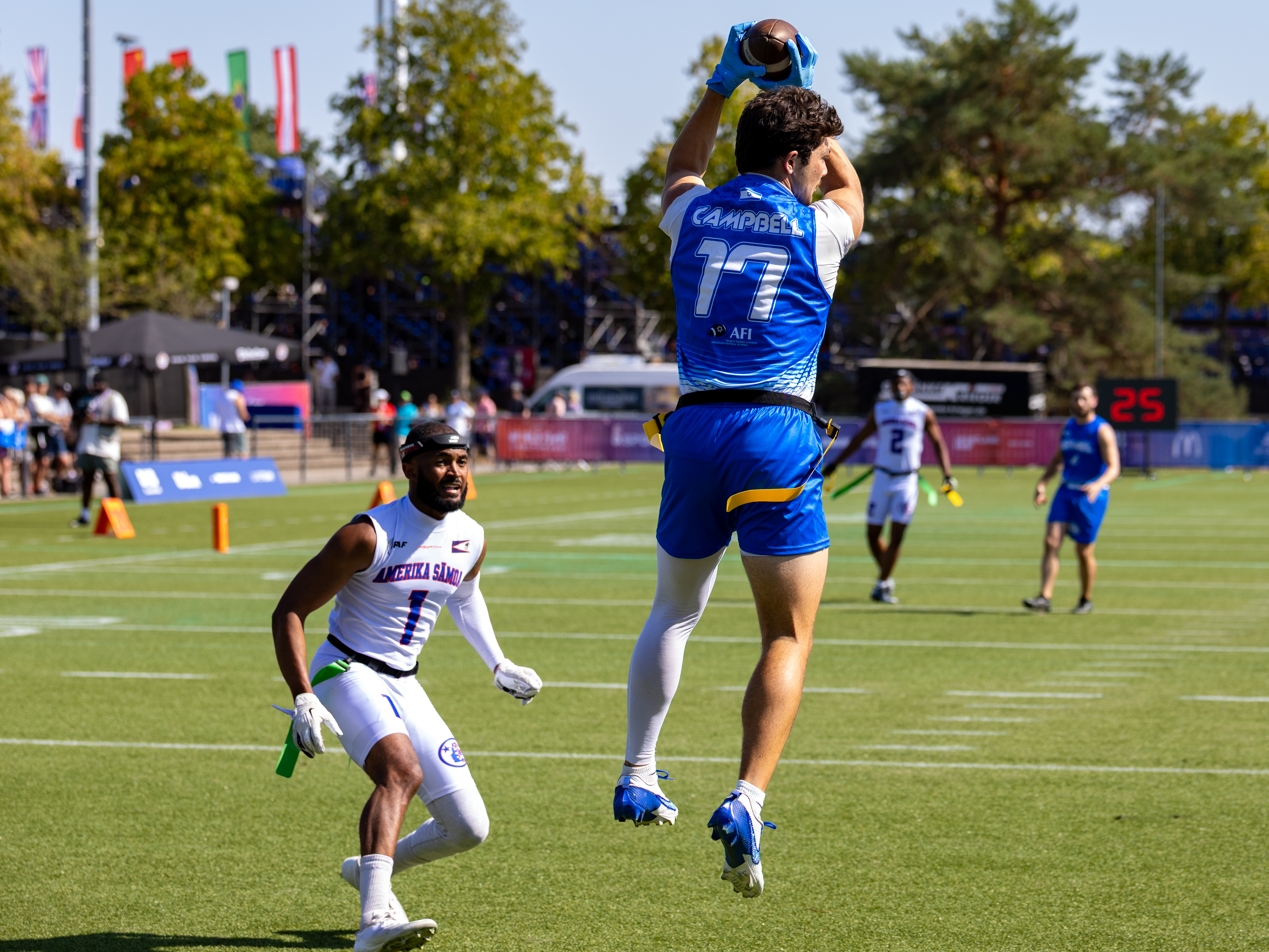 #17 CARTER CAMPBELL (WR) Team Israel Men jump high to catch the catch the touchdown.
