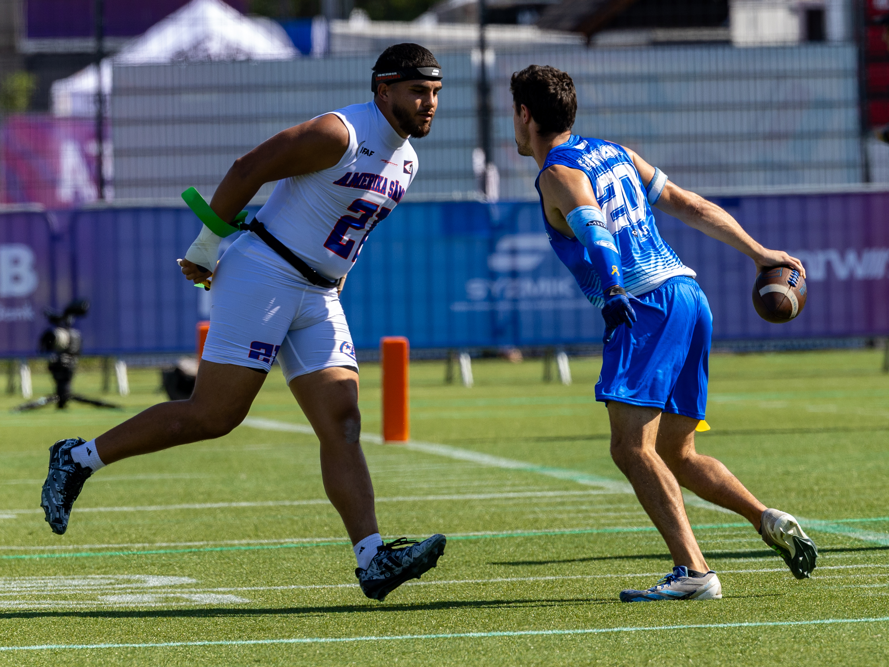 #21 London Constantine Teidemann Iakopo (WR/DB) Team American Samoa Men catch the flag from #20 DANIEL EASTMAN (DB) Team Israel Men