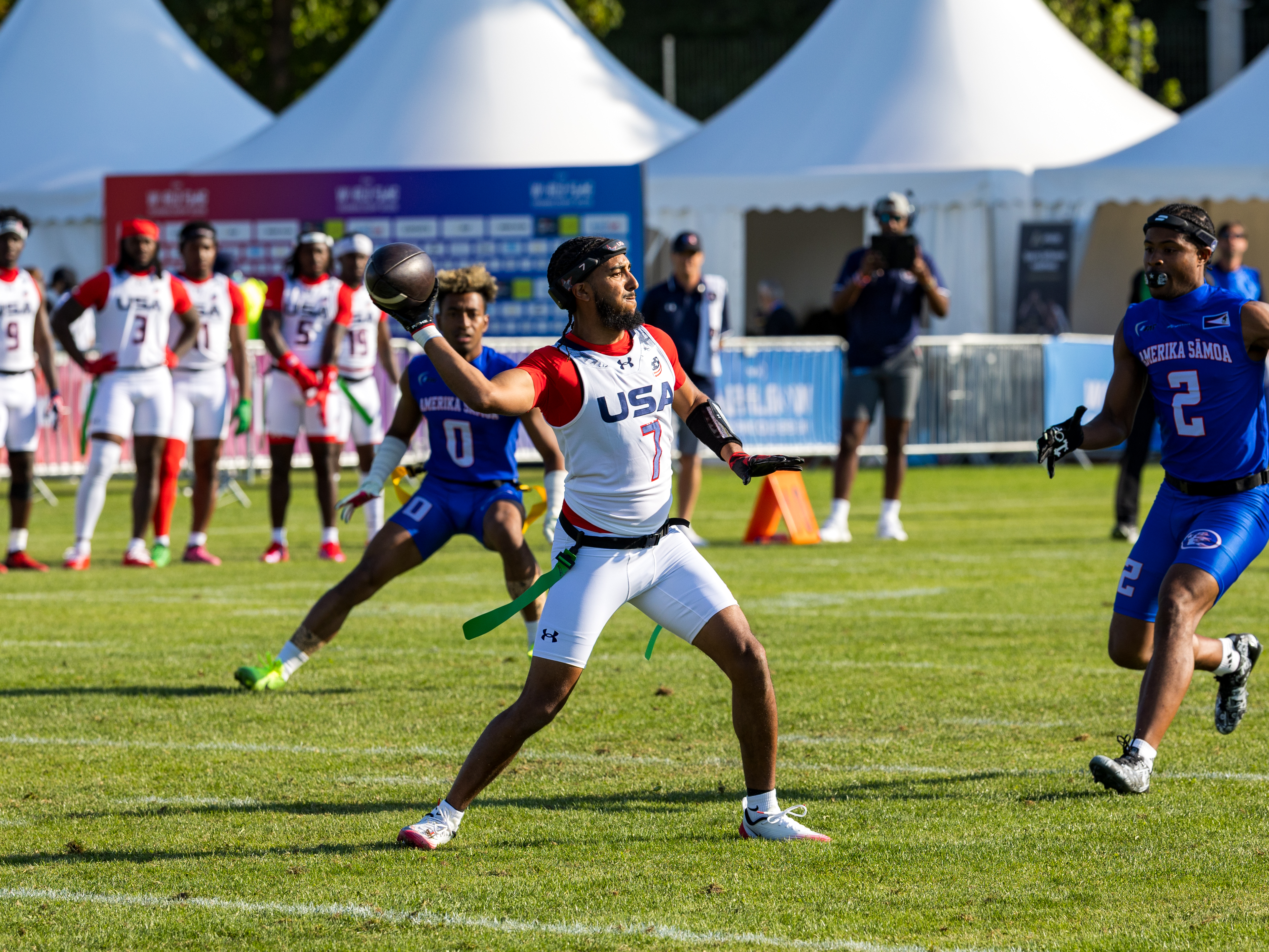 #7 Darrell "Housh" Doucette III (QB/ATH) pass the ball. #2 Antonio Hill (WR/DB) Team American Samoa Men to late for catch the flag.