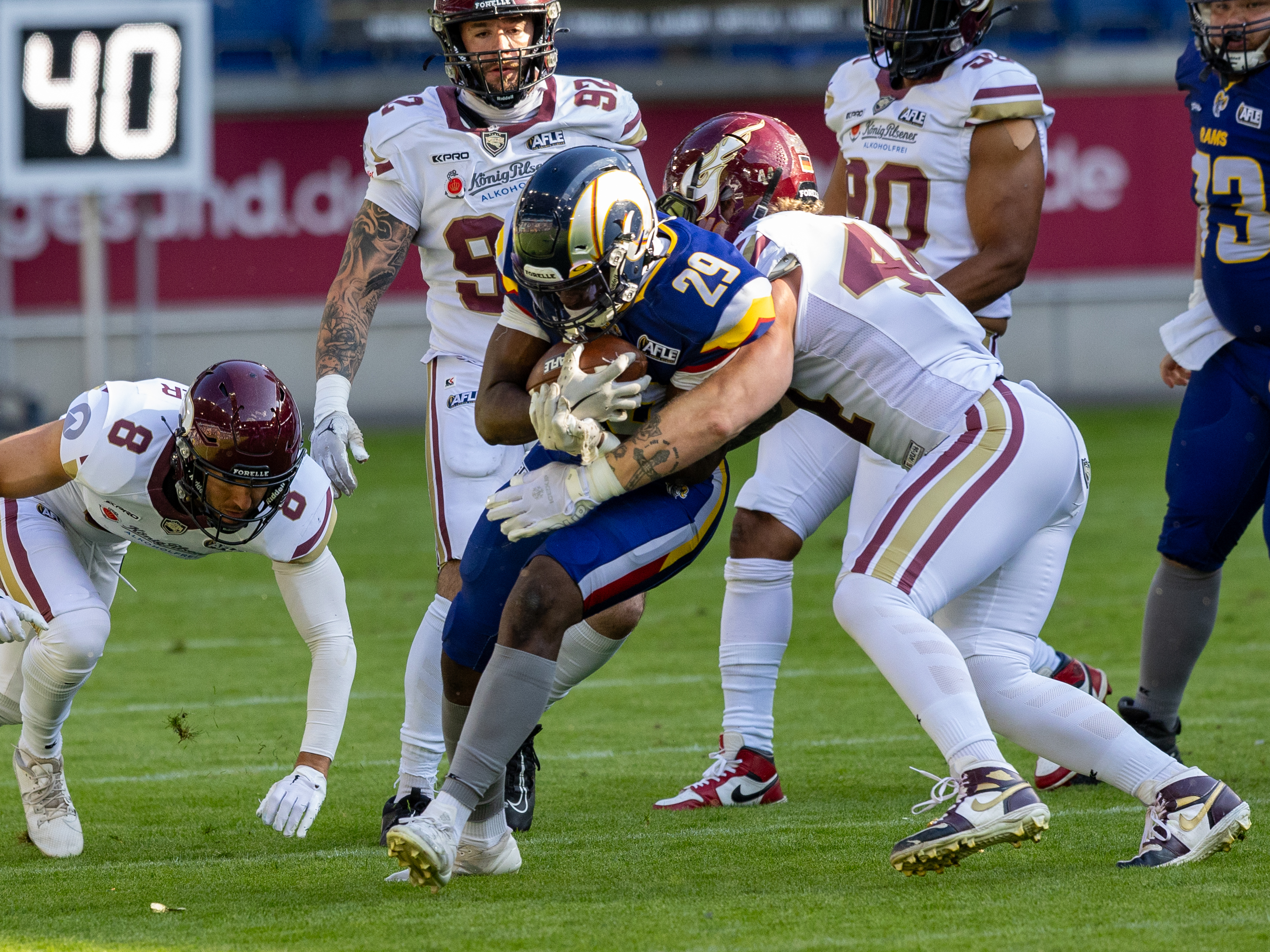 #44 Marius Kensy (Linebacker) – Rhein Fire tackle #29 Lionel Bangala (Running Back) – Alpine Rams