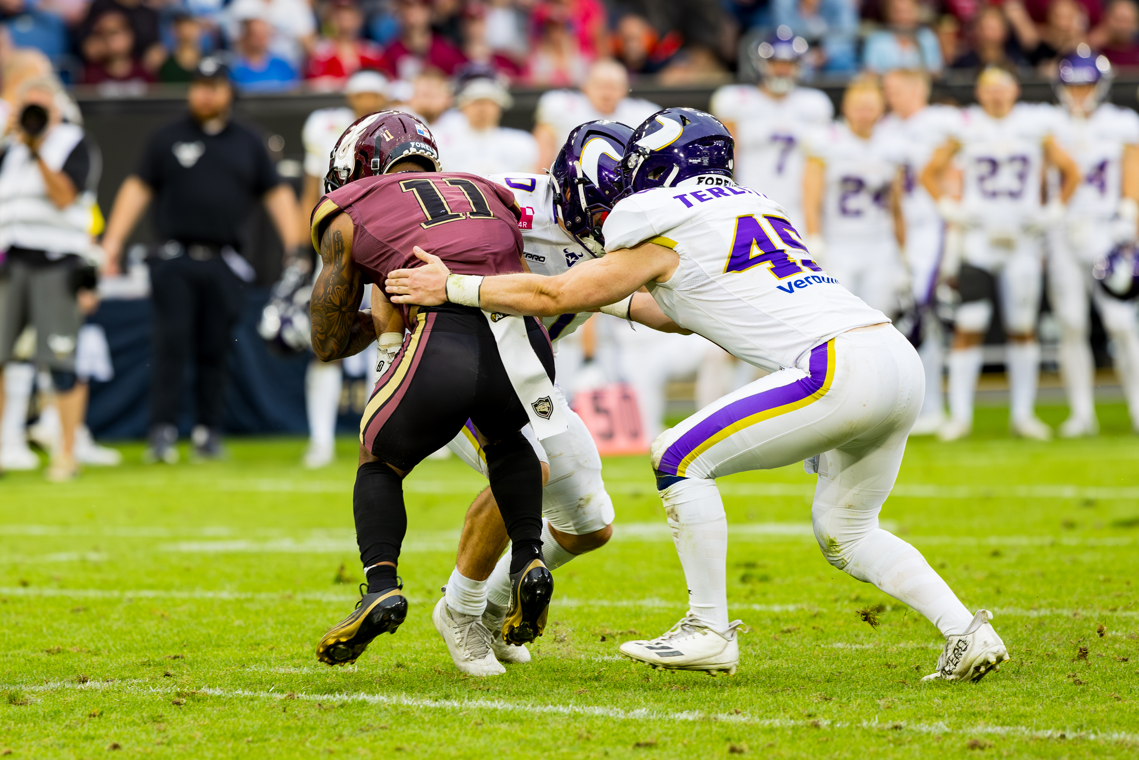 #0 Noel Swancar (Linebacker) – Vienna Vikings and #45 Nikolaus Terlitza (Linebacker) – Vienna Vikings tackle #11 Jonathan Scott (Halfback) – Rhein Fire
