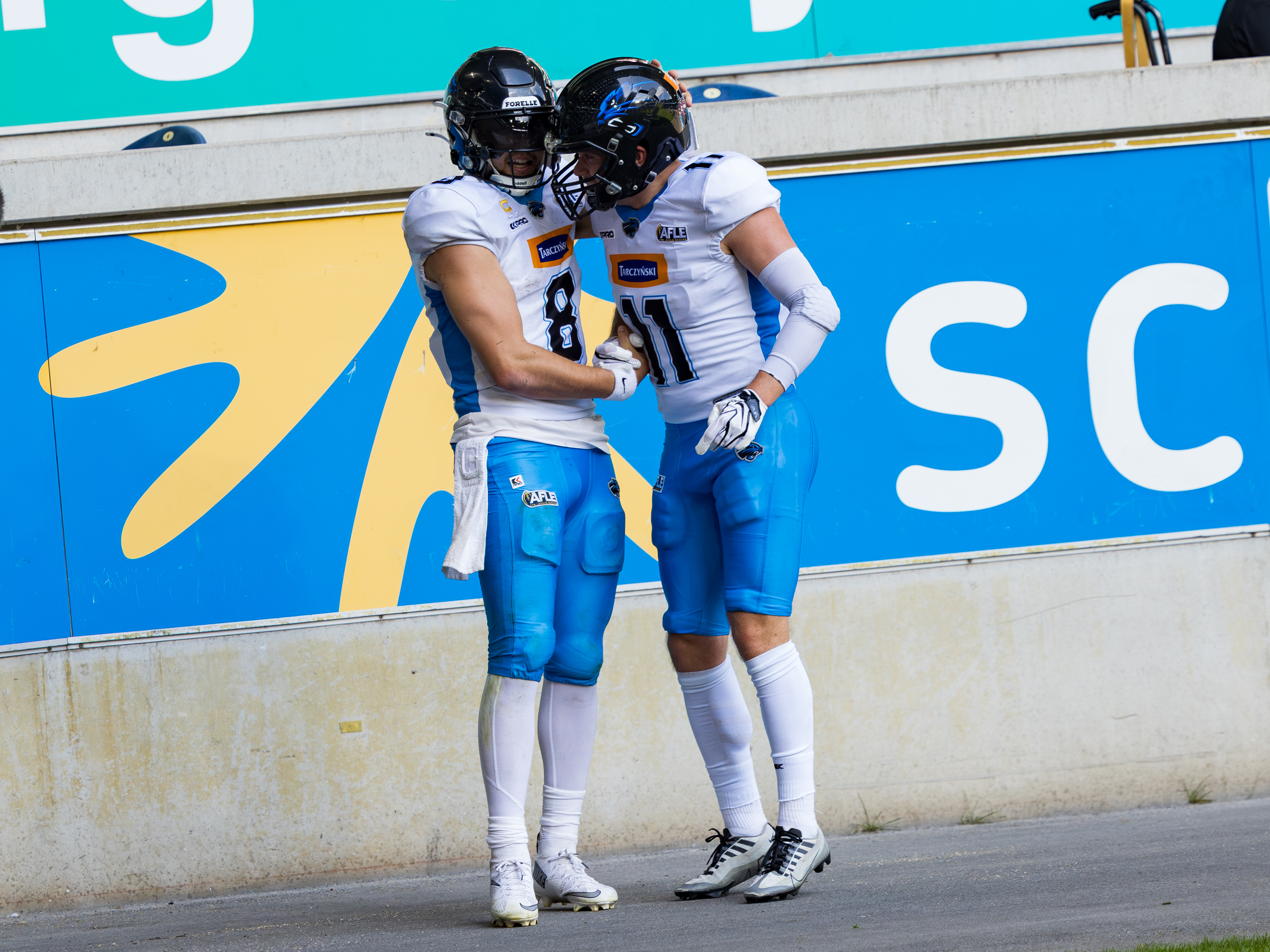 #11 Ott Ottender (Wide Receiver) – Panthers Wroclaw and #8 Jameson Wang (Quarterback) – Panthers Wroclaw touchdown celebration.