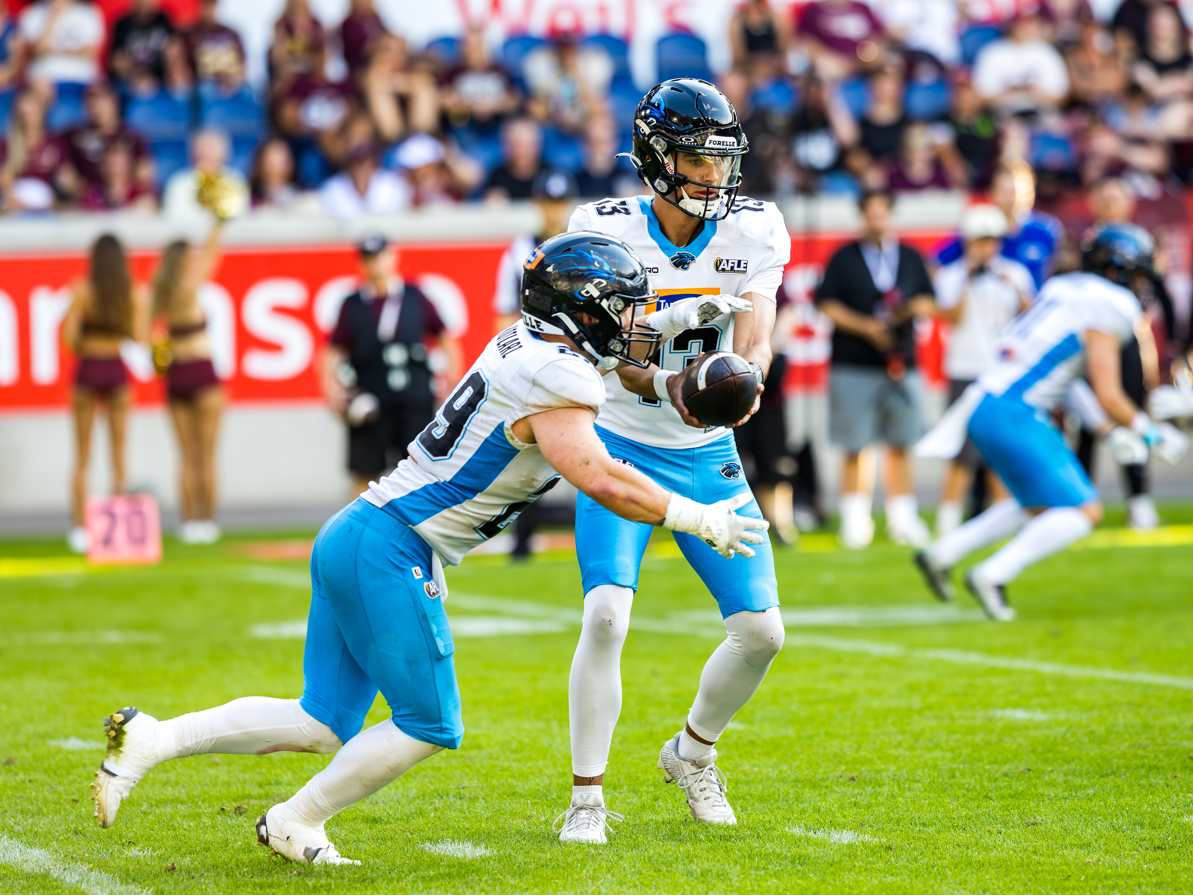#13 Diego Lliteras (Quarterback) – Panthers Wroclaw give #29 Kamil Kotlarz (Running Back) – Panthers Wroclaw the ball.