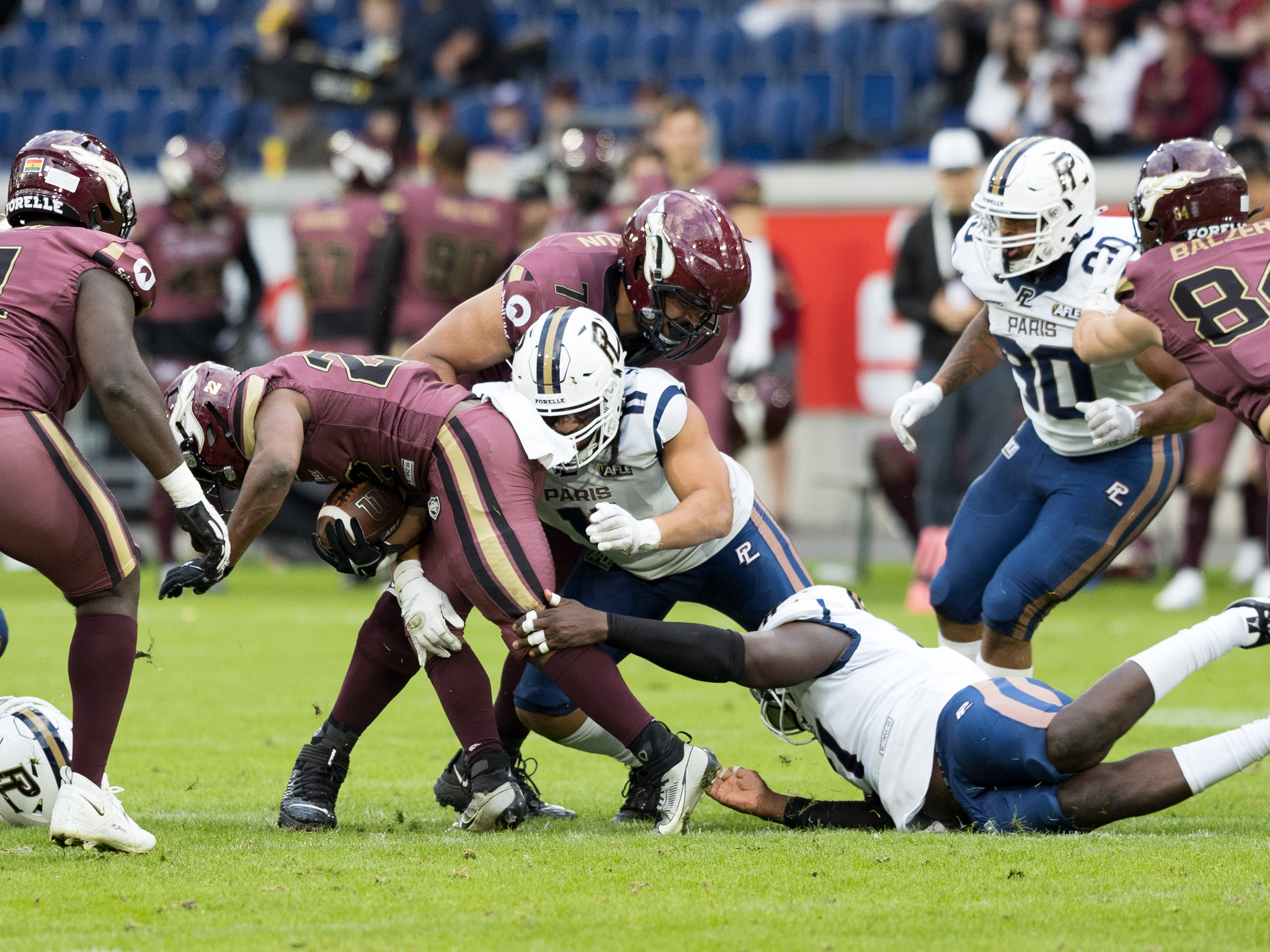 #11 Zaire Ugapo (Defensive End) – Paris Lights takle #22 Marvellous Imade (Running Back) – Rhein Fire Rhein Fire vs Paris Lights, American Football, American Football League Europe, WEEK 4, 2026, 13.06.2026,