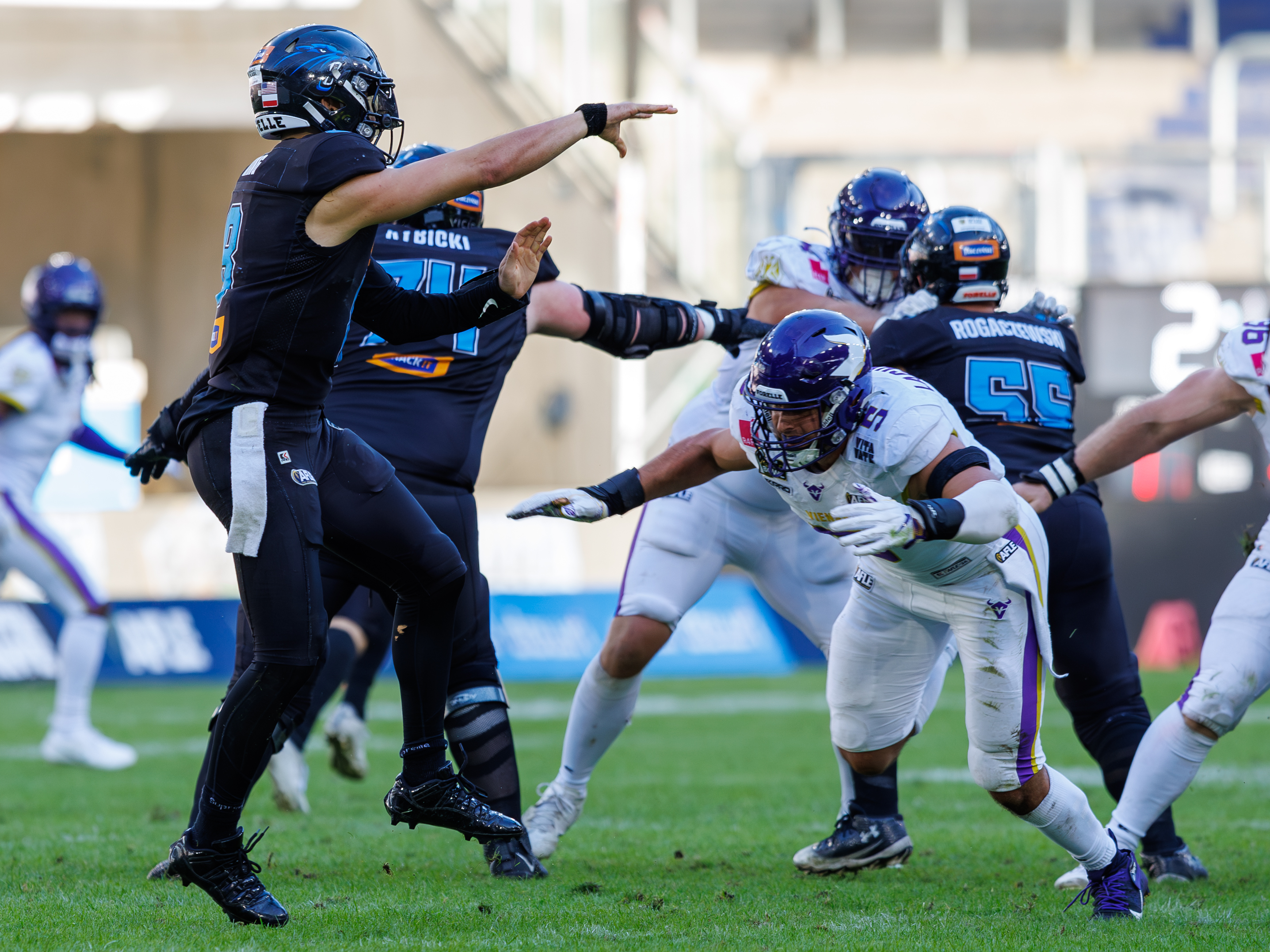 #8 Jameson Wang (Quarterback) – Panthers Wroclaw pass the ball. #5 Robert Lachmann (Defensive End) – Vienna Vikings to late for a tackle