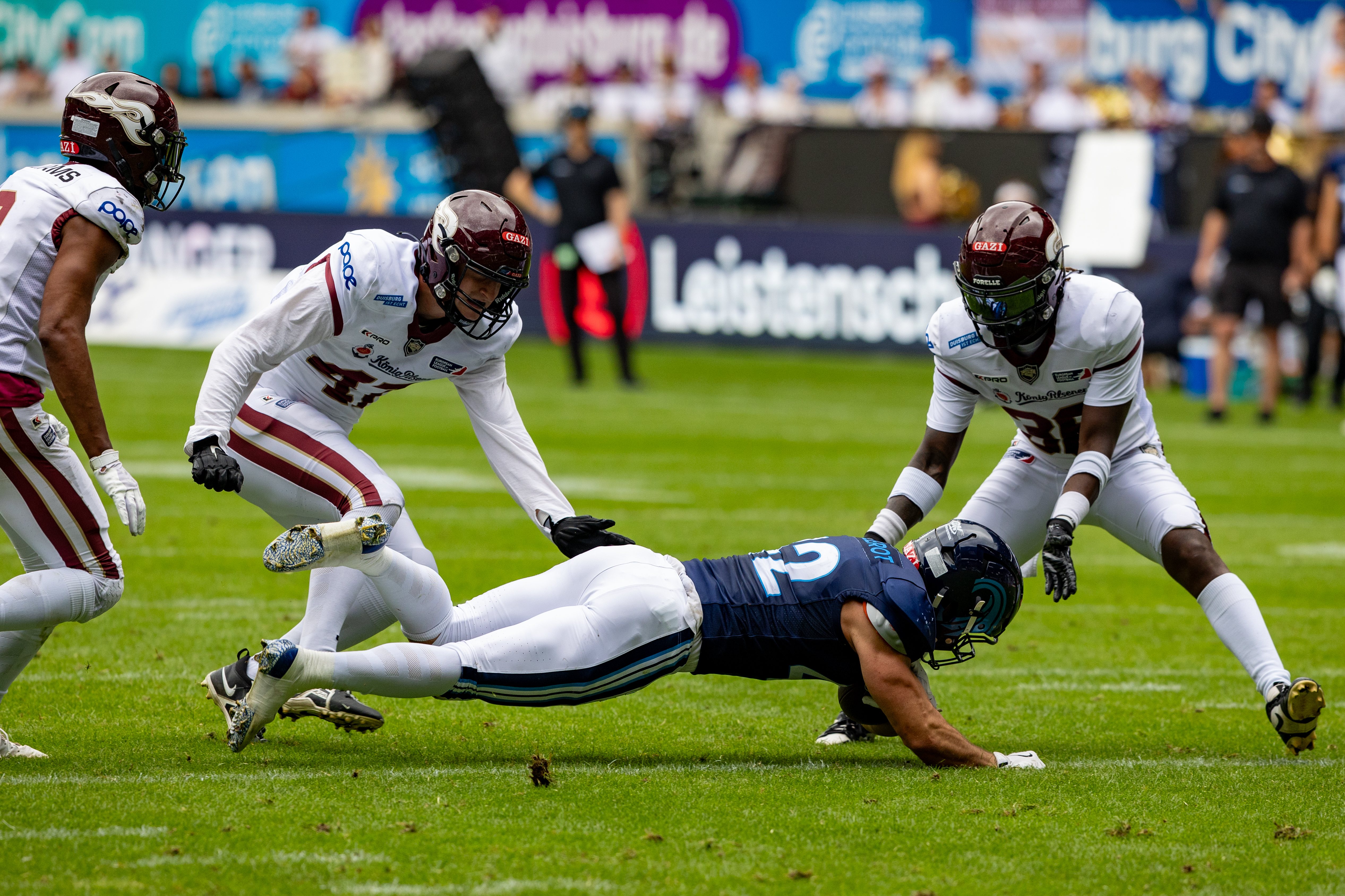 #42 Armand Soulerot (RB) Nordic Storm followed by #2 Omari Williams (FS) Rhein Fire and #41 Liam Kling (DE) Rhein Fire, #38 Marvin Djomou (CB) Rhein Fire Rhein Fire vs Nordic Storm, American Football, European League of Football, Week 14, 2025, 17.08.2025,
