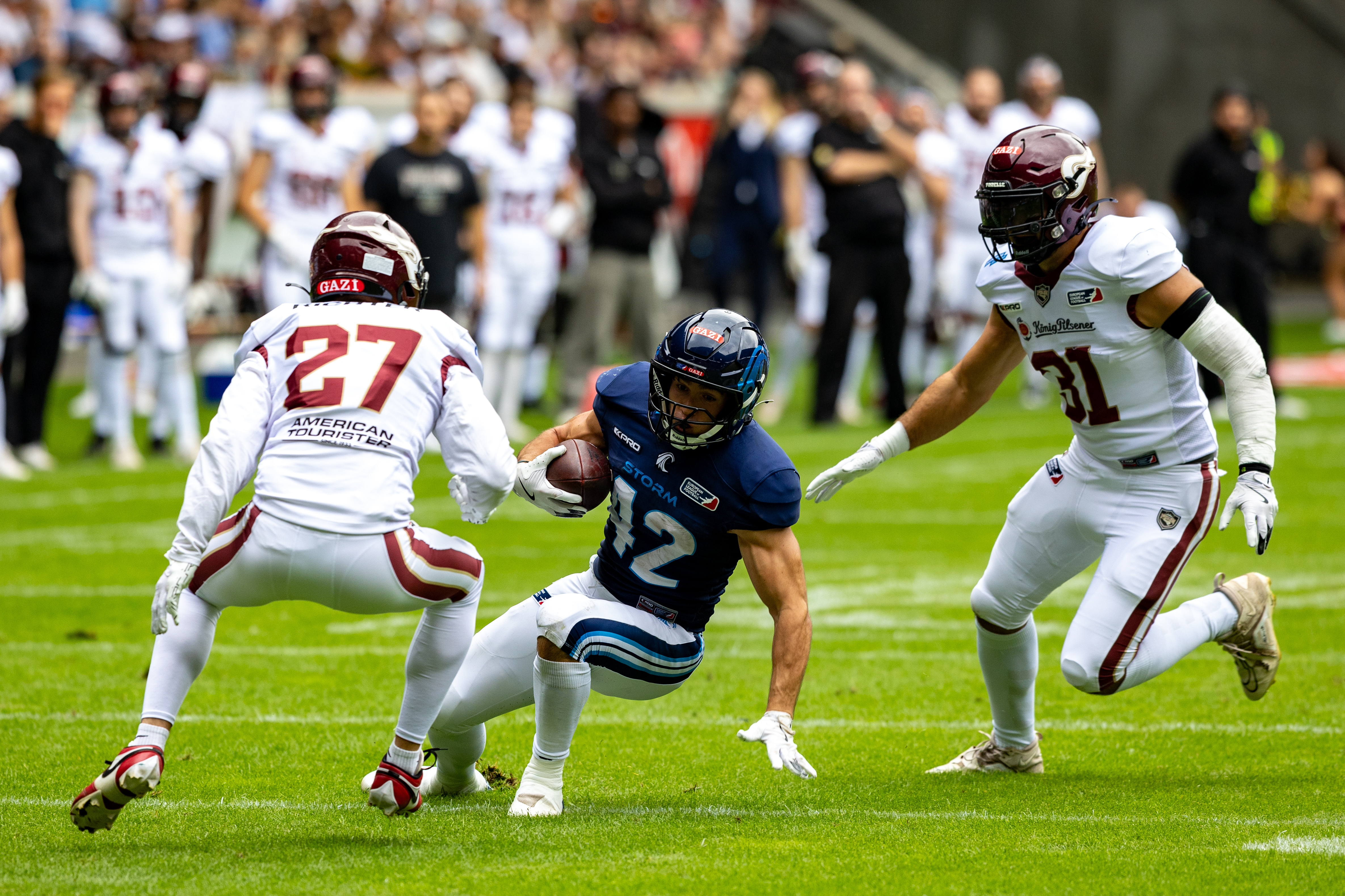 #42 Armand Soulerot (RB) Nordic Storm run with the ball. #27 Max Richter (SS) Rhein Fire and #31 Flamur Simon (LB) Rhein Fire Rhein Fire vs Nordic Storm, American Football, European League of Football, Week 14, 2025, 17.08.2025,