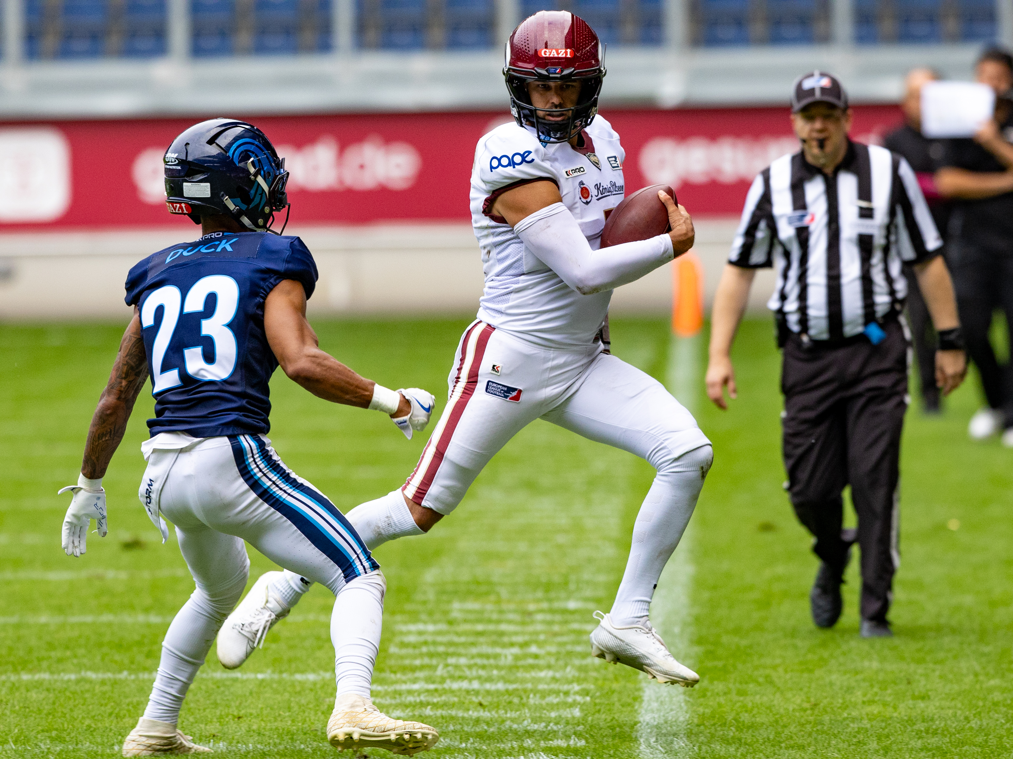 #1 Chad Jeffries (QB) Rhein Fire run out the field. Rhein Fire vs Nordic Storm, American Football, European League of Football, Week 14, 2025, 17.08.2025,